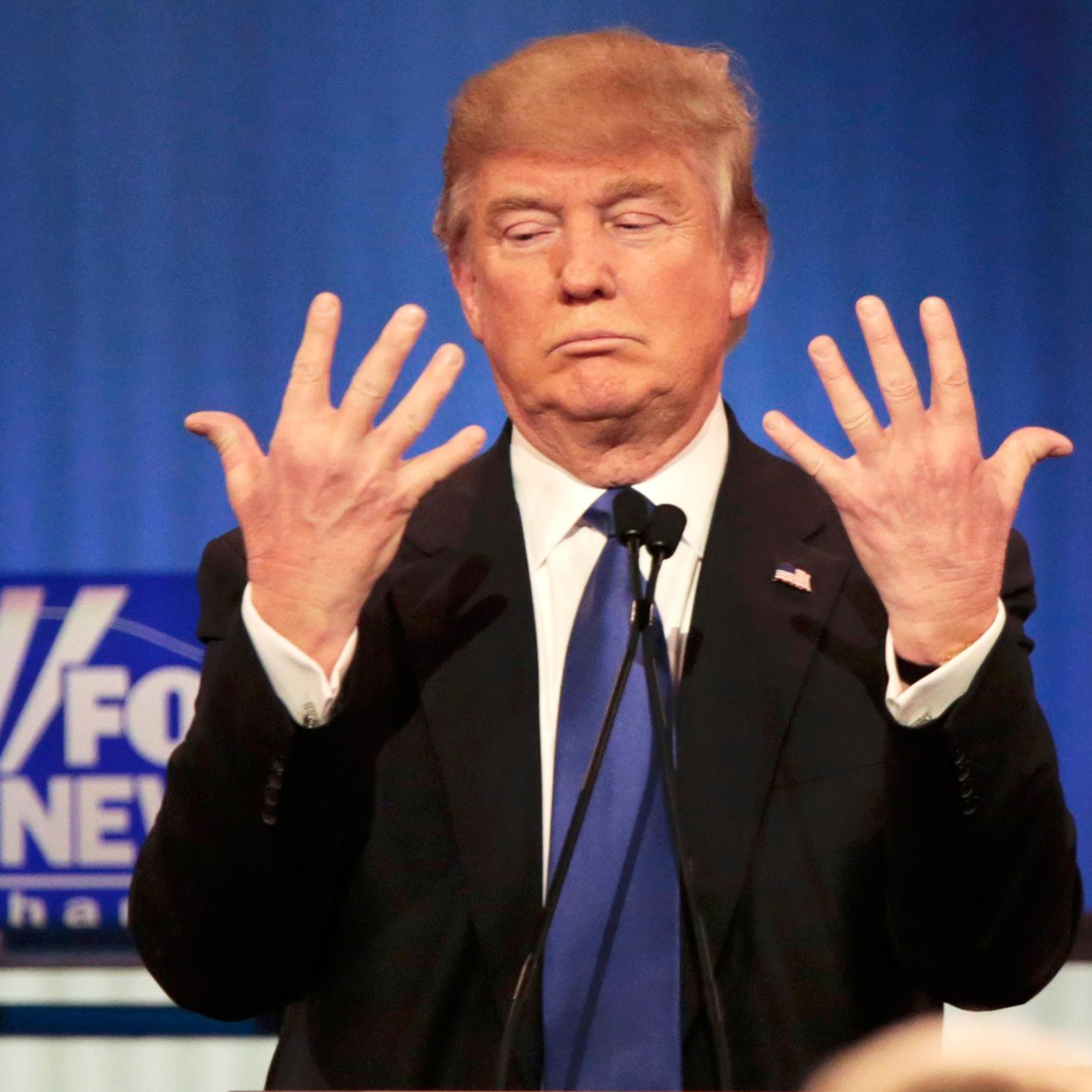 Republican presidential candidate Donald Trump shows off the size of his hands during a debate in Detroit, on March 3.