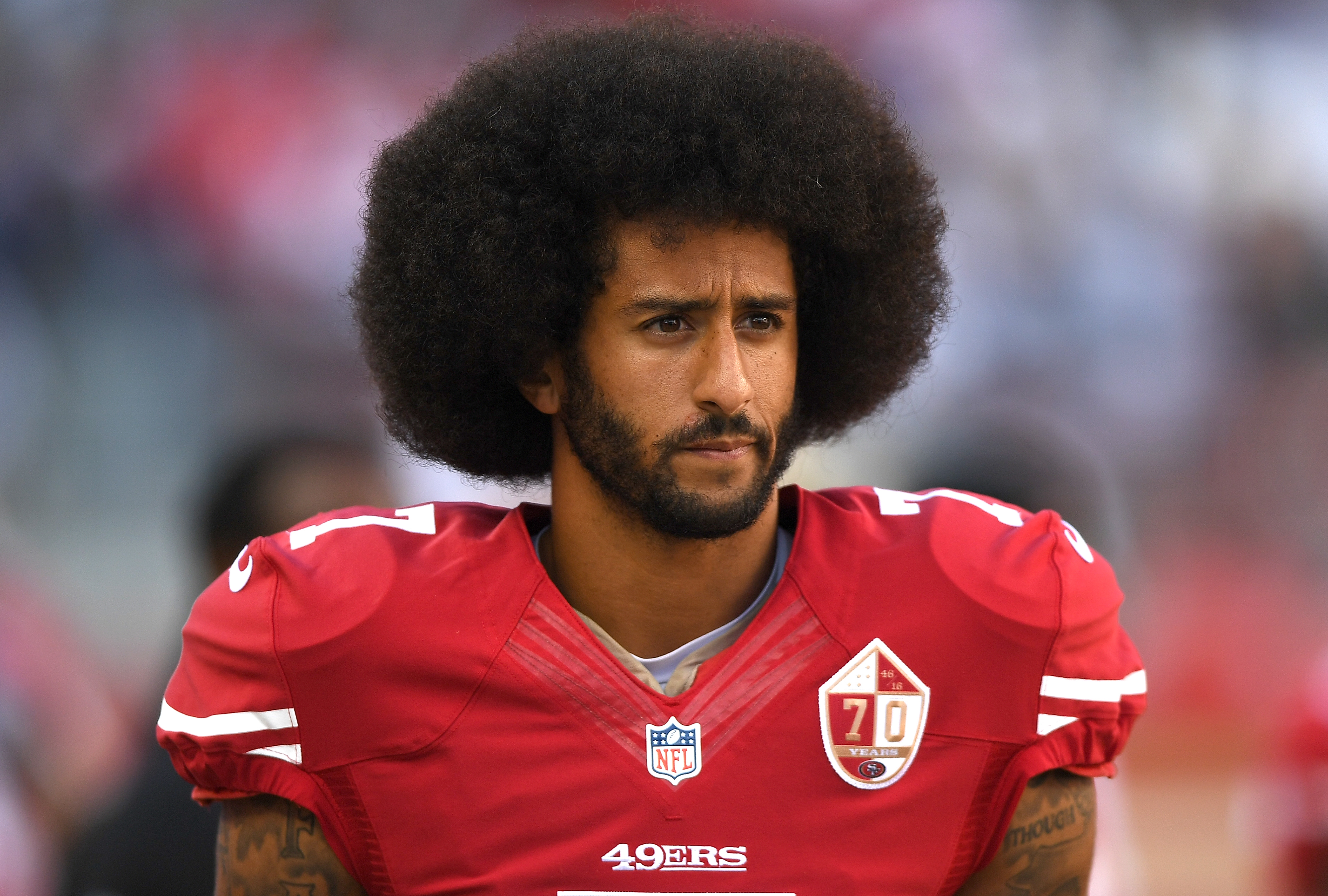Colin Kaepernick #7 of the San Francisco 49ers looks on from the sidelines against the Dallas Cowboys during the second half of their NFL football game at Levi's Stadium on October 2, 2016 in Santa Clara, California.