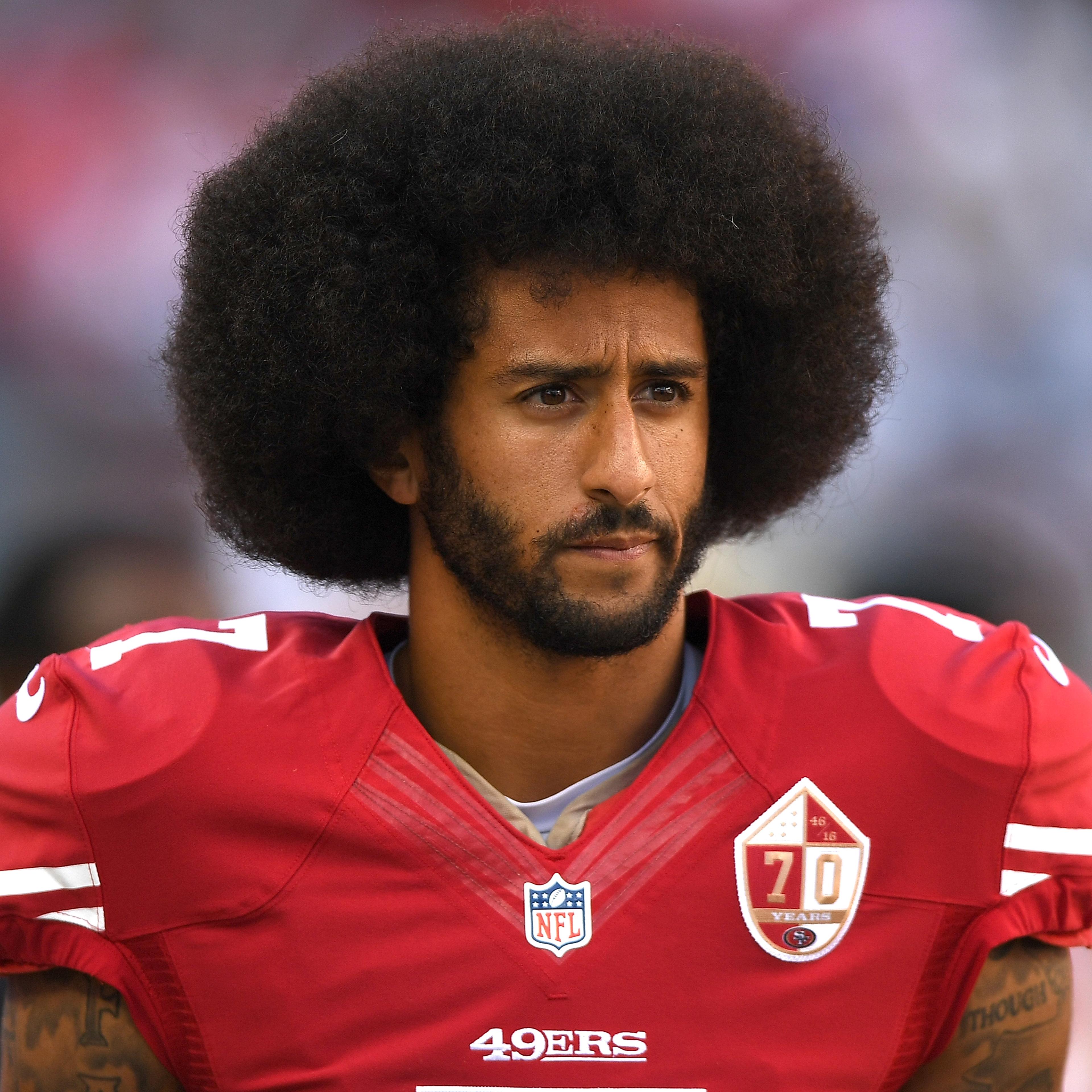 Colin Kaepernick #7 of the San Francisco 49ers looks on from the sidelines against the Dallas Cowboys during the second half of their NFL football game at Levi's Stadium on October 2, 2016 in Santa Clara, California.