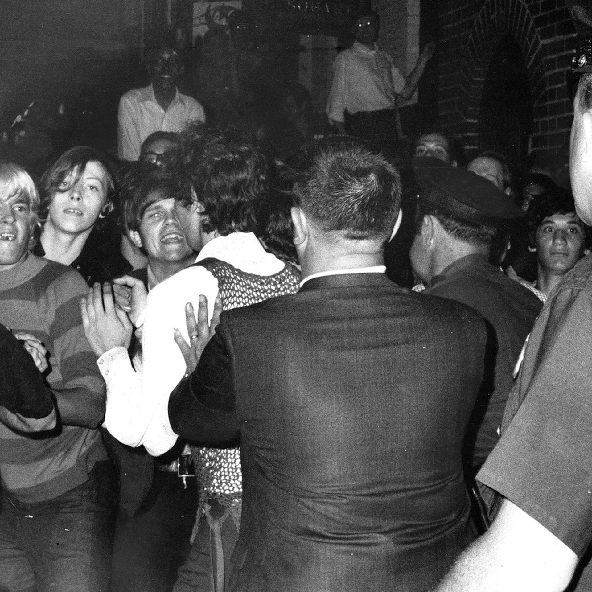 Stonewall Inn nightclub raid. Crowd attempts to impede polic