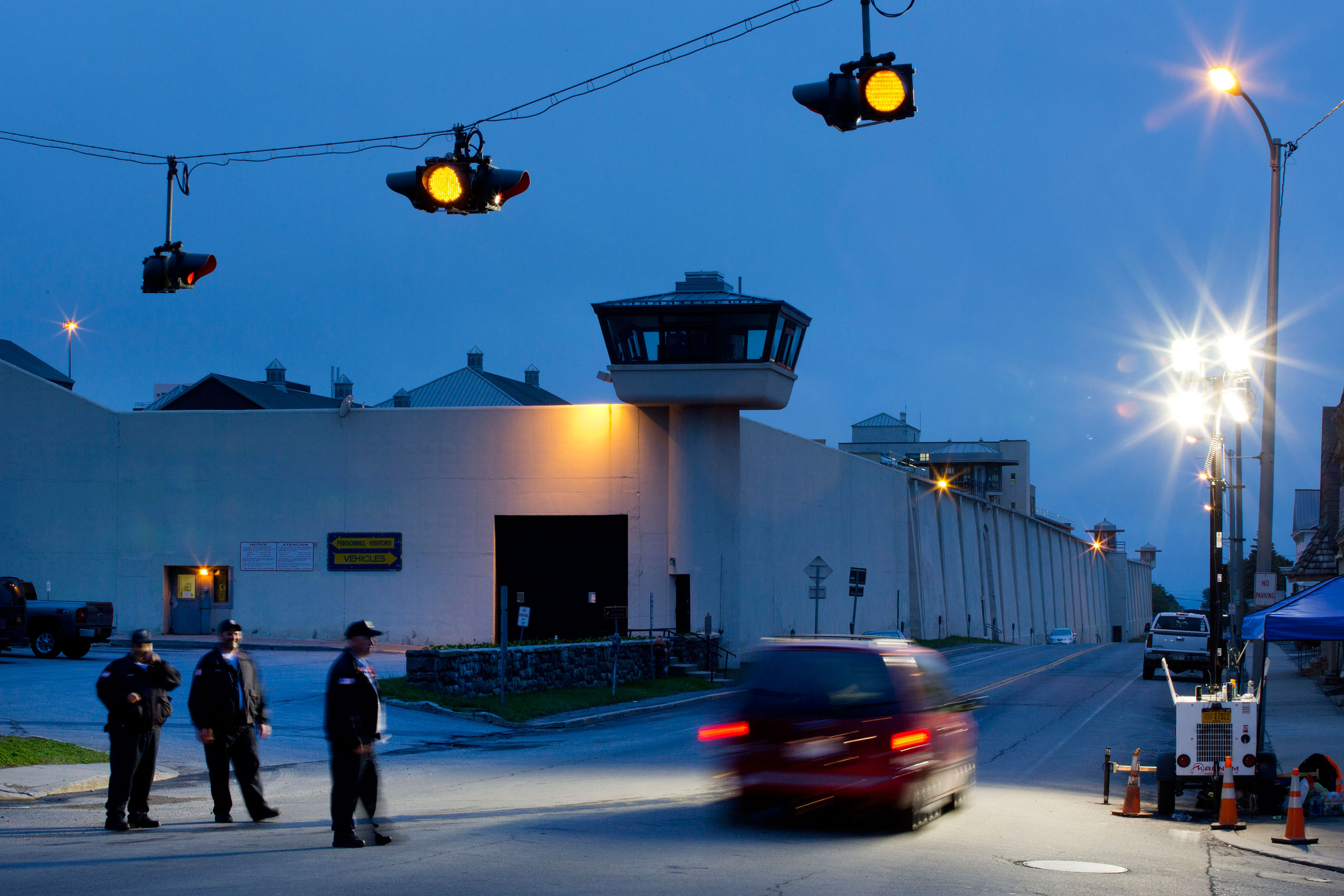 FILE - In this June 15, 2015, file photo, corrections officers watch an intersection in front of Clinton Correctional Facility in Dannemora, N.Y. David Sweat and Richard Matt escaped from the prison June 6. Sweat was captured on Sunday, June 28; Matt was