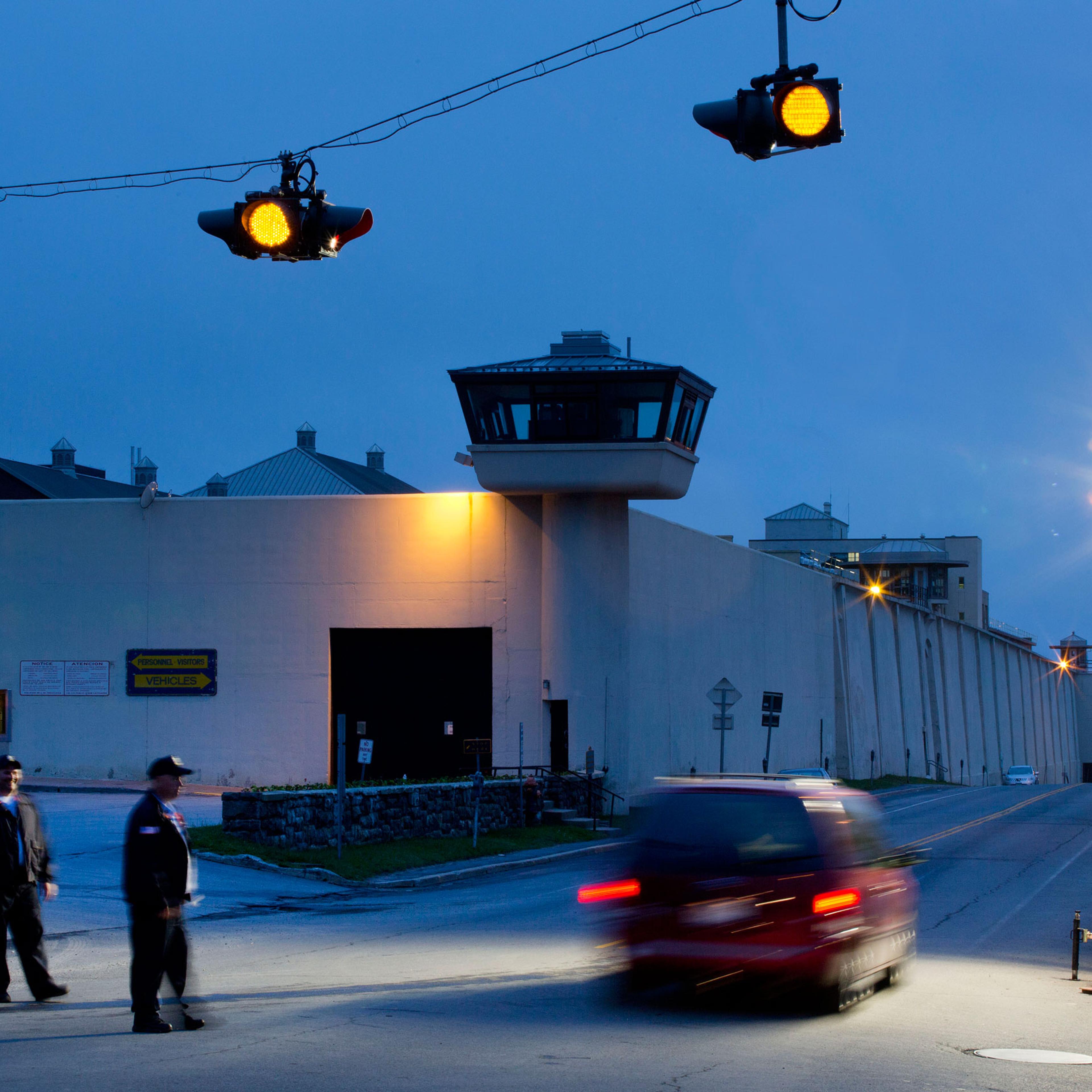 FILE - In this June 15, 2015, file photo, corrections officers watch an intersection in front of Clinton Correctional Facility in Dannemora, N.Y. David Sweat and Richard Matt escaped from the prison June 6. Sweat was captured on Sunday, June 28; Matt was