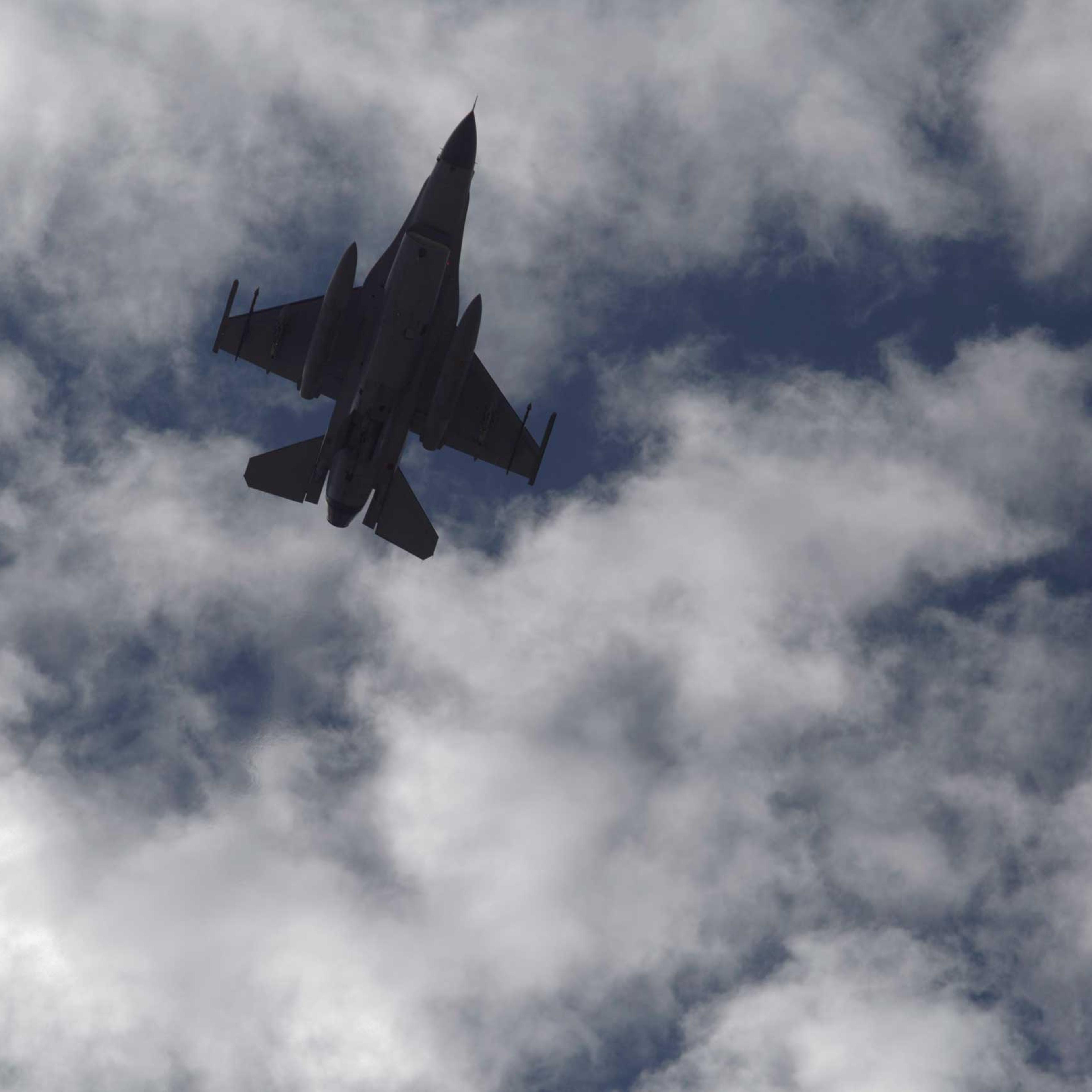 A Jordanian Air Force fighter jet flies over the village of Ai as Jordanian King Abdullah II visits to offer his condolences to the tribe of the slain Jordanian pilot, Lt. Muath al-Kaseasbeh at their home village near Karak, Jordan, Feb. 5, 2015.
