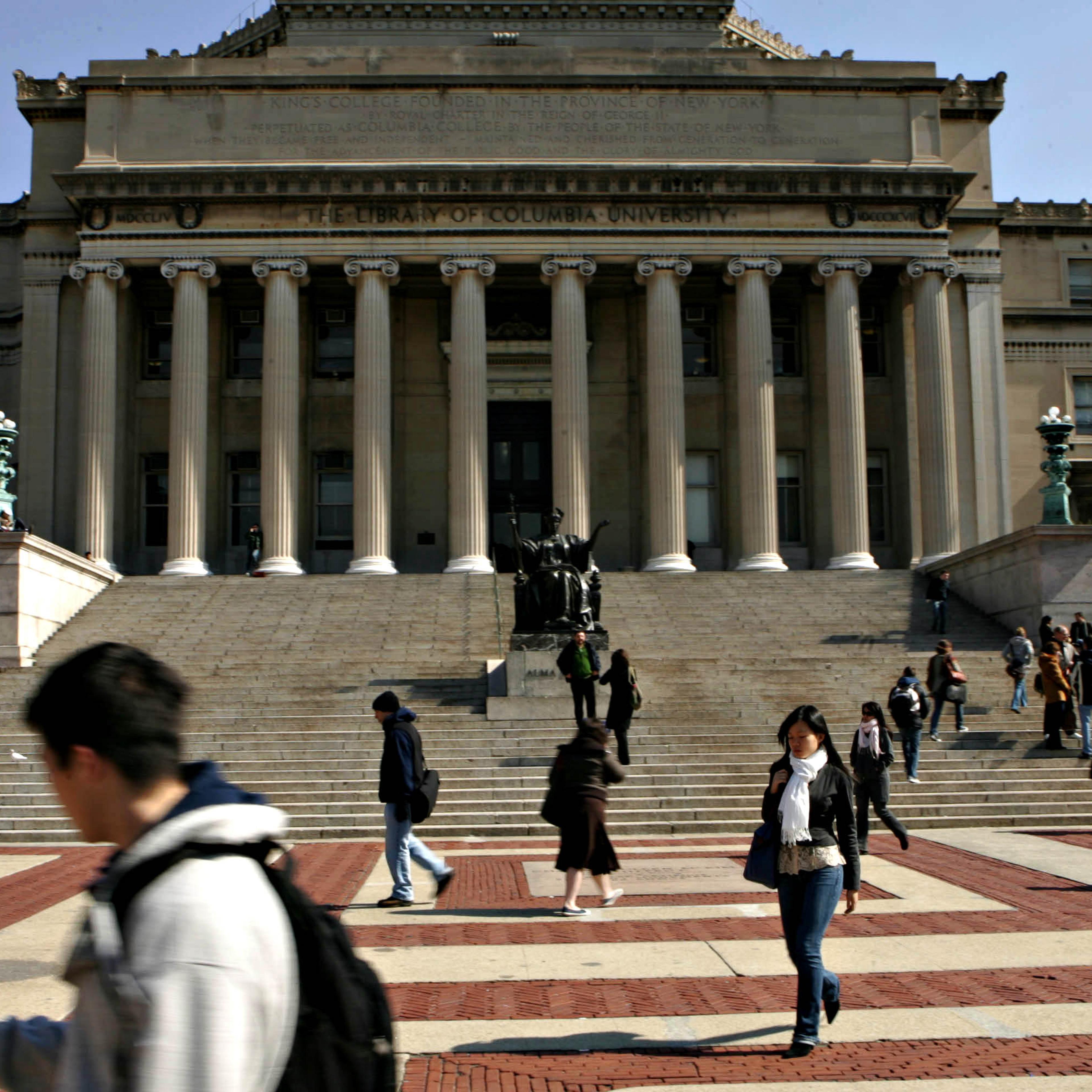 Students walk across the campus of Columbia University in New York City