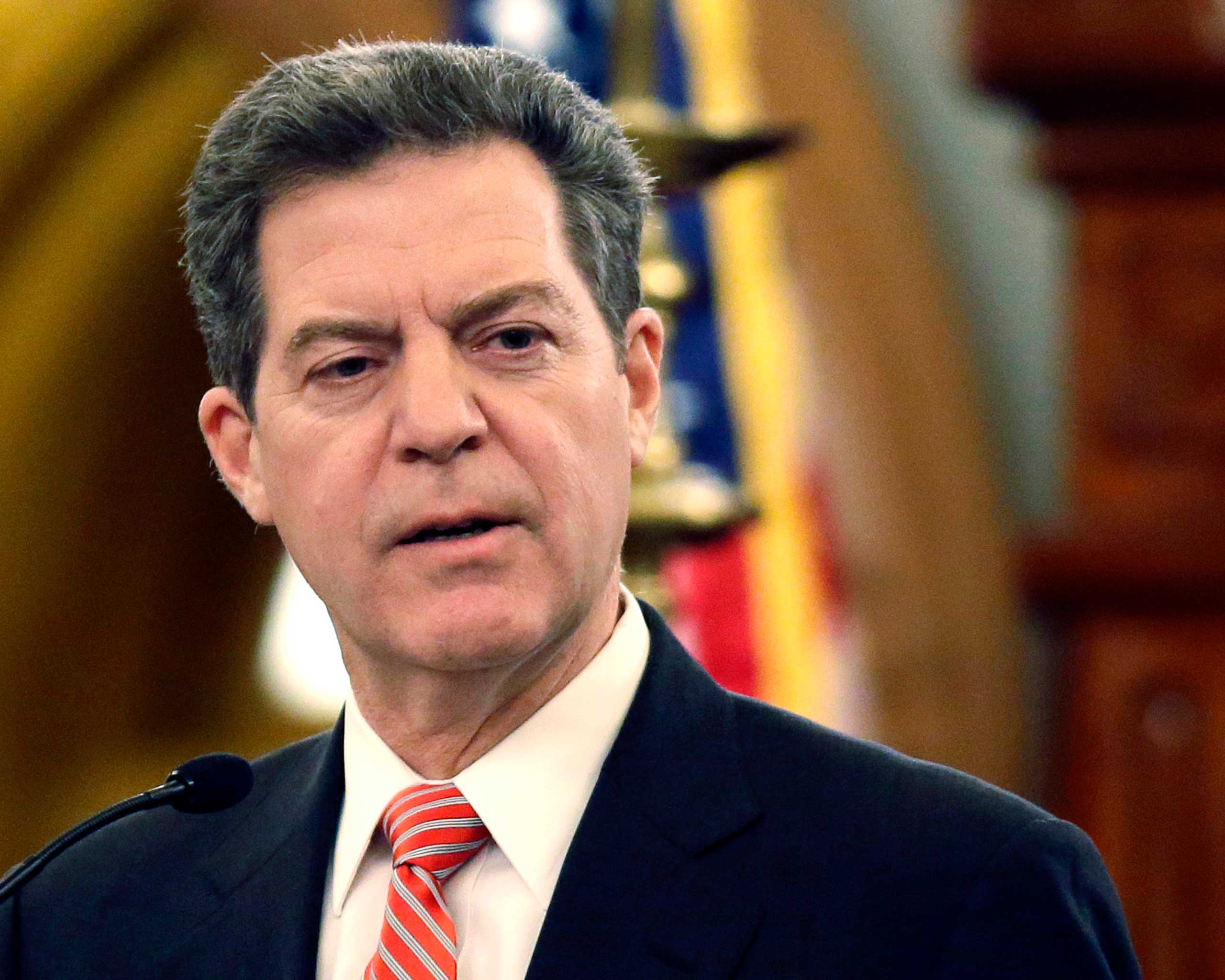 Kansas Gov. Sam Brownback speaks at the Kansas Statehouse in Topeka, Kan., Jan. 2015.