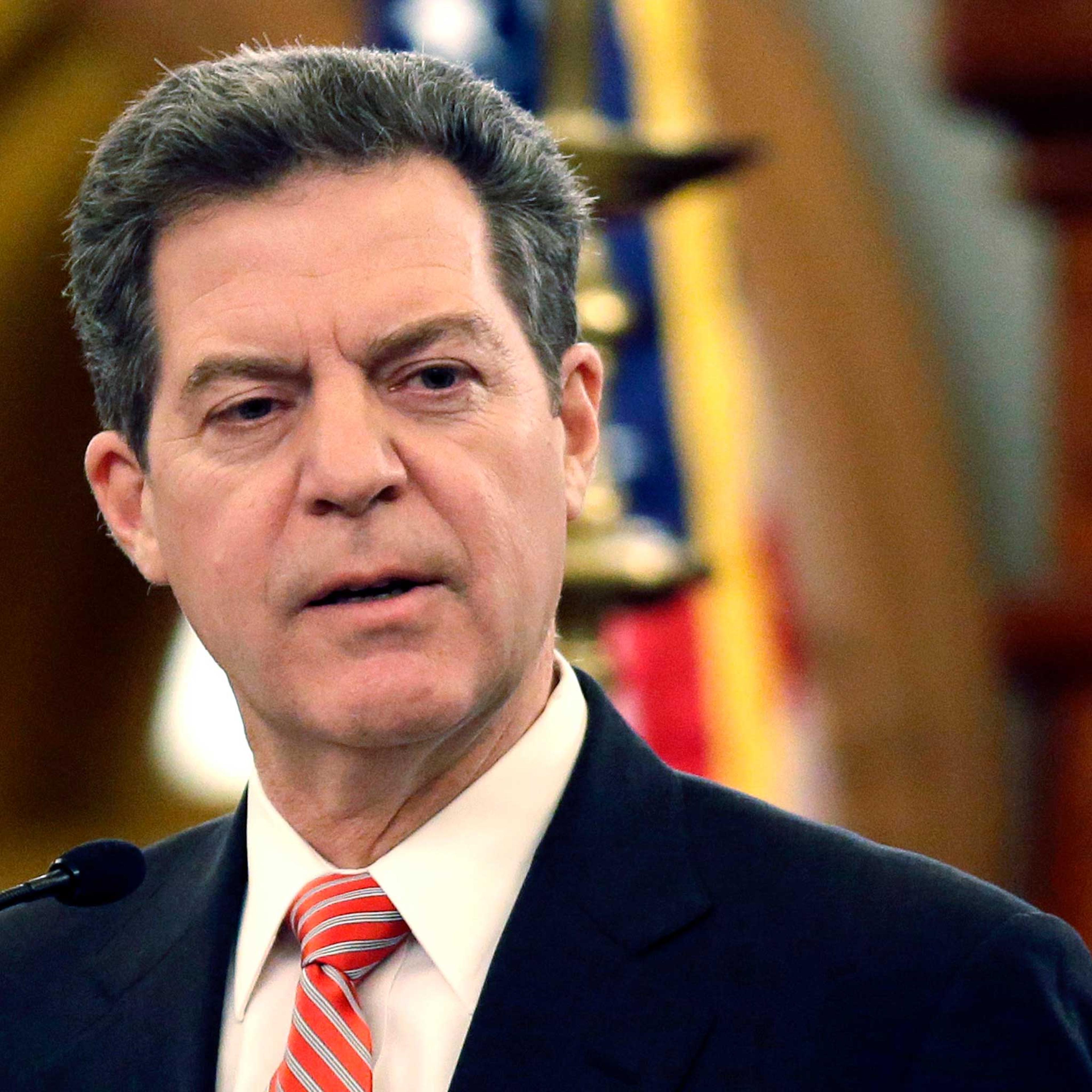 Kansas Gov. Sam Brownback speaks at the Kansas Statehouse in Topeka, Kan., Jan. 2015.