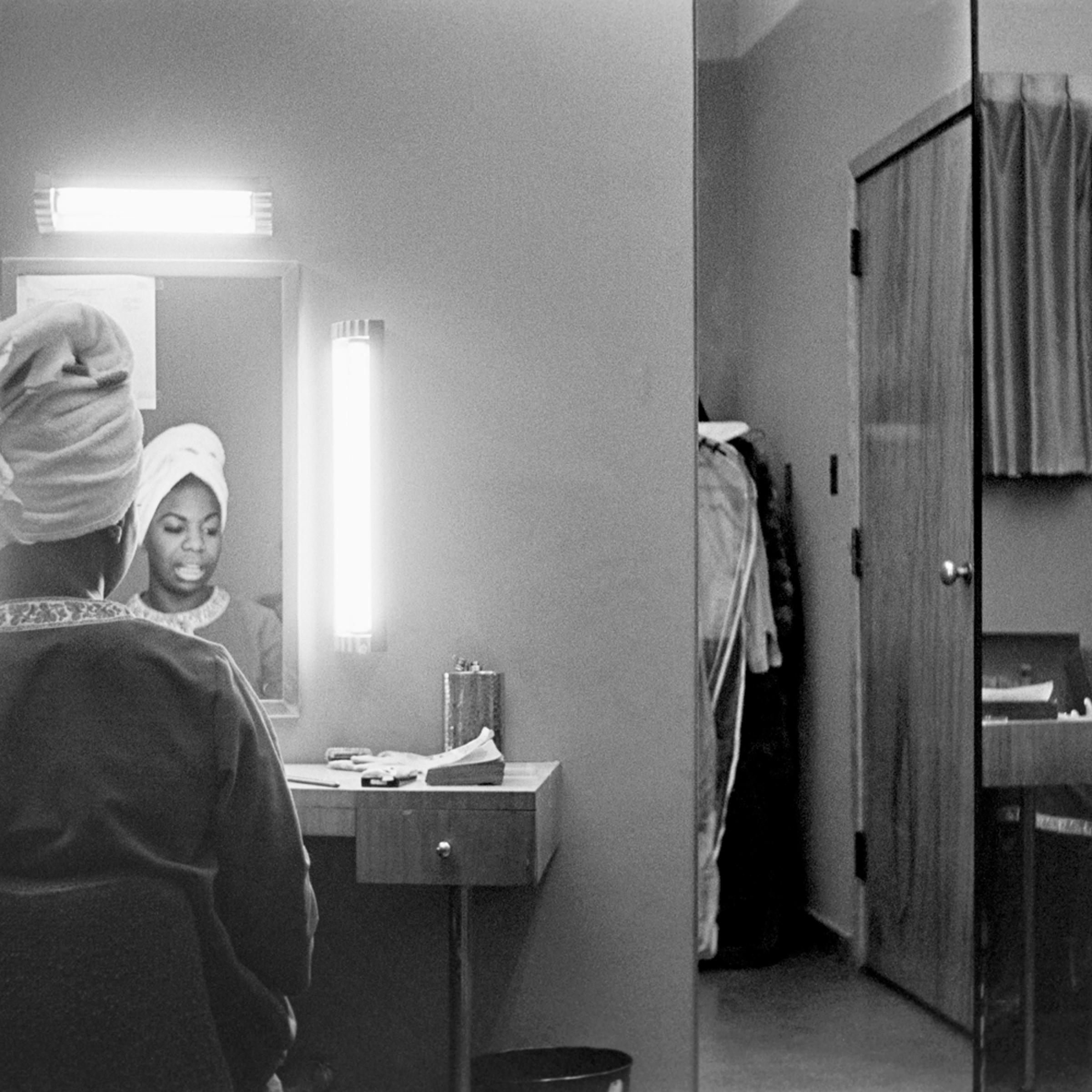 Nina Simone getting ready in a motel room in Buffalo, New York. December 1964.