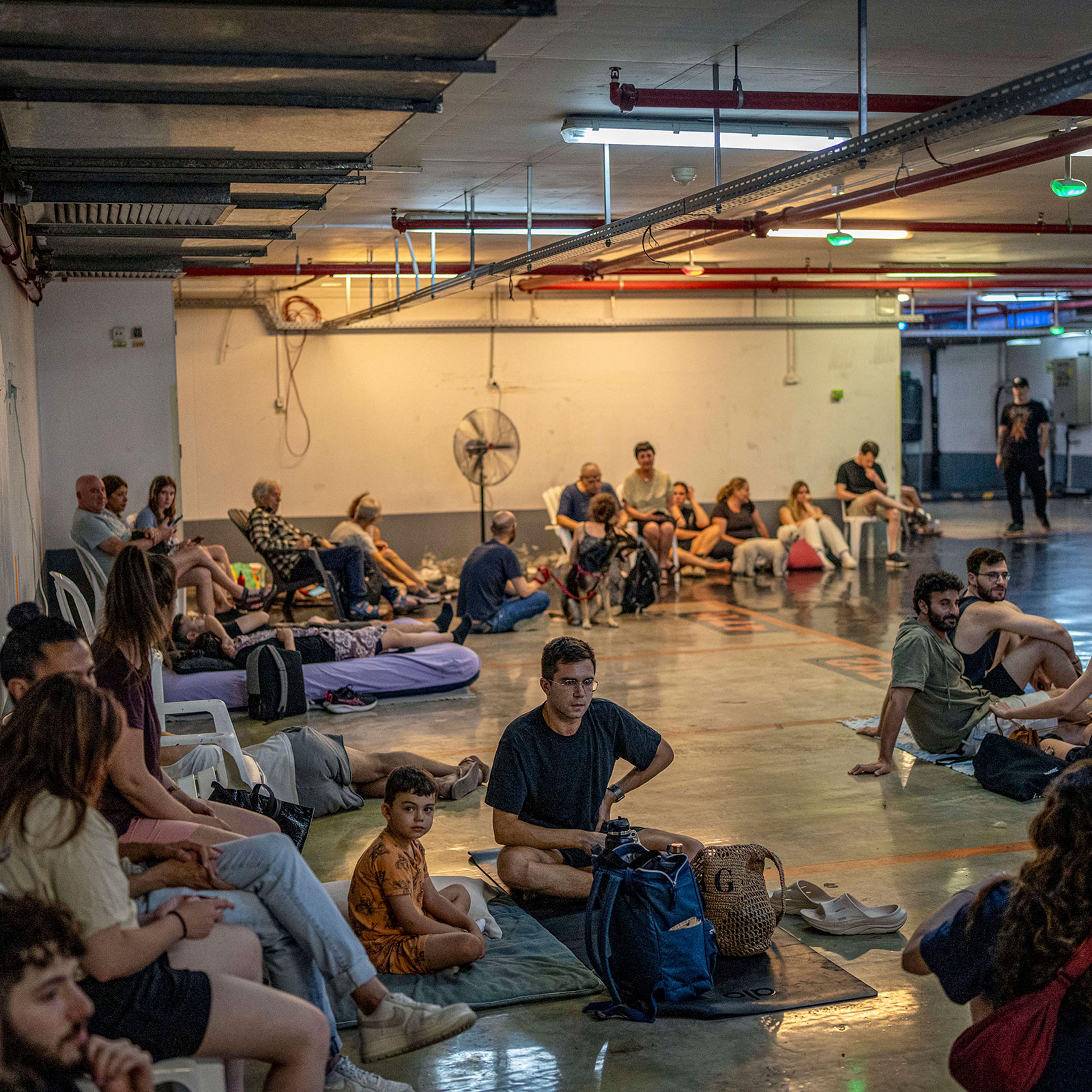 Israelis take shelter in an underground station as they anticipate another missile attack by Iran on June, 17 2025.
