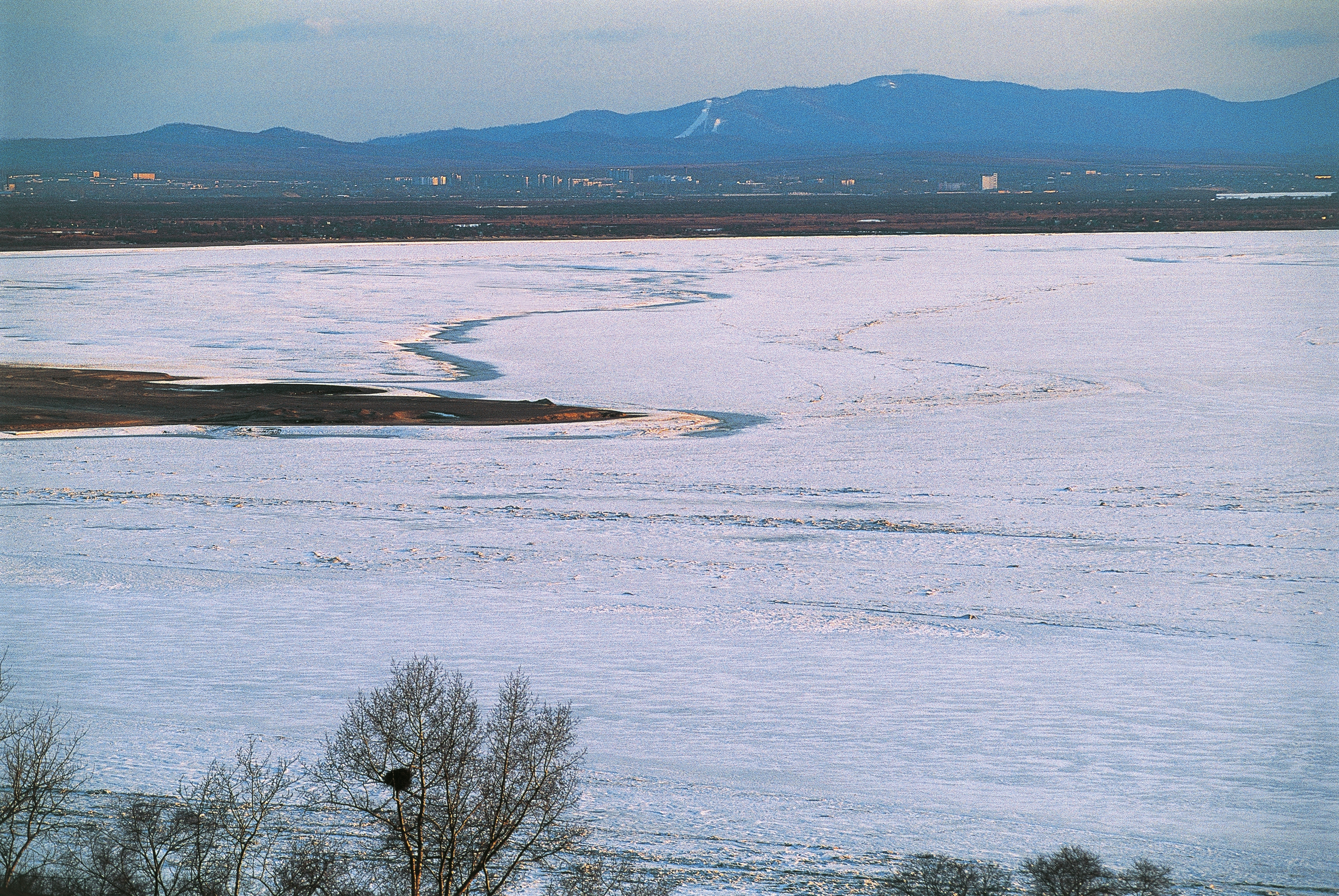 The frozen Amur river near city of Khabarovsk