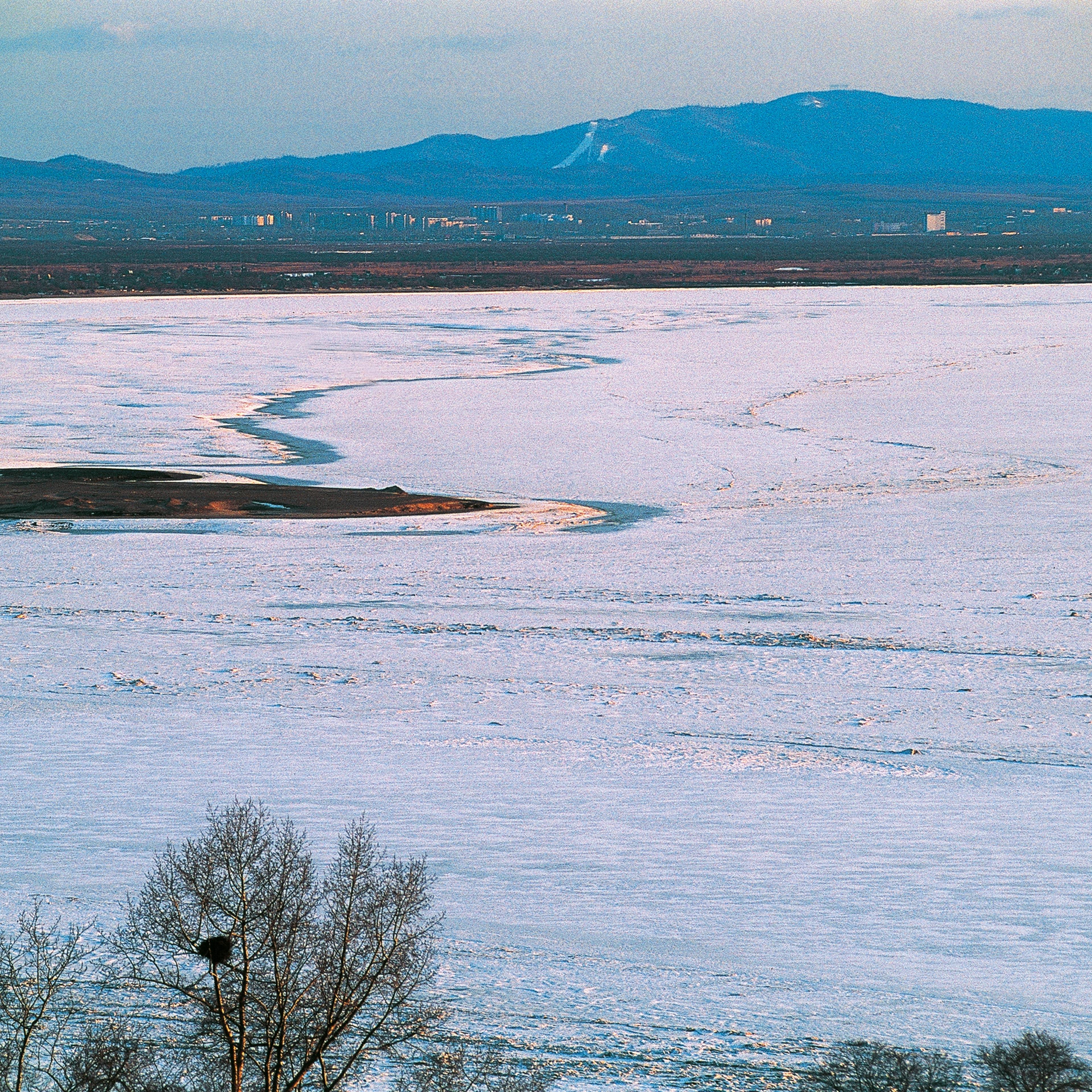 The frozen Amur river near city of Khabarovsk