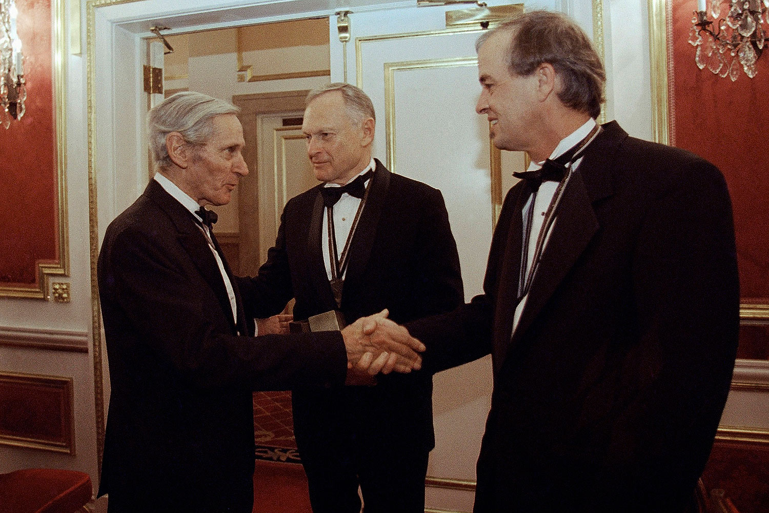 In this Nov. 16, 1994, file photo, The National Book Awards prize winning writers Sherwin B. Nuland, center, William Gaddis, left, and James Tate greet each other after the awards ceremony in New York. Nuland, has died at age 83