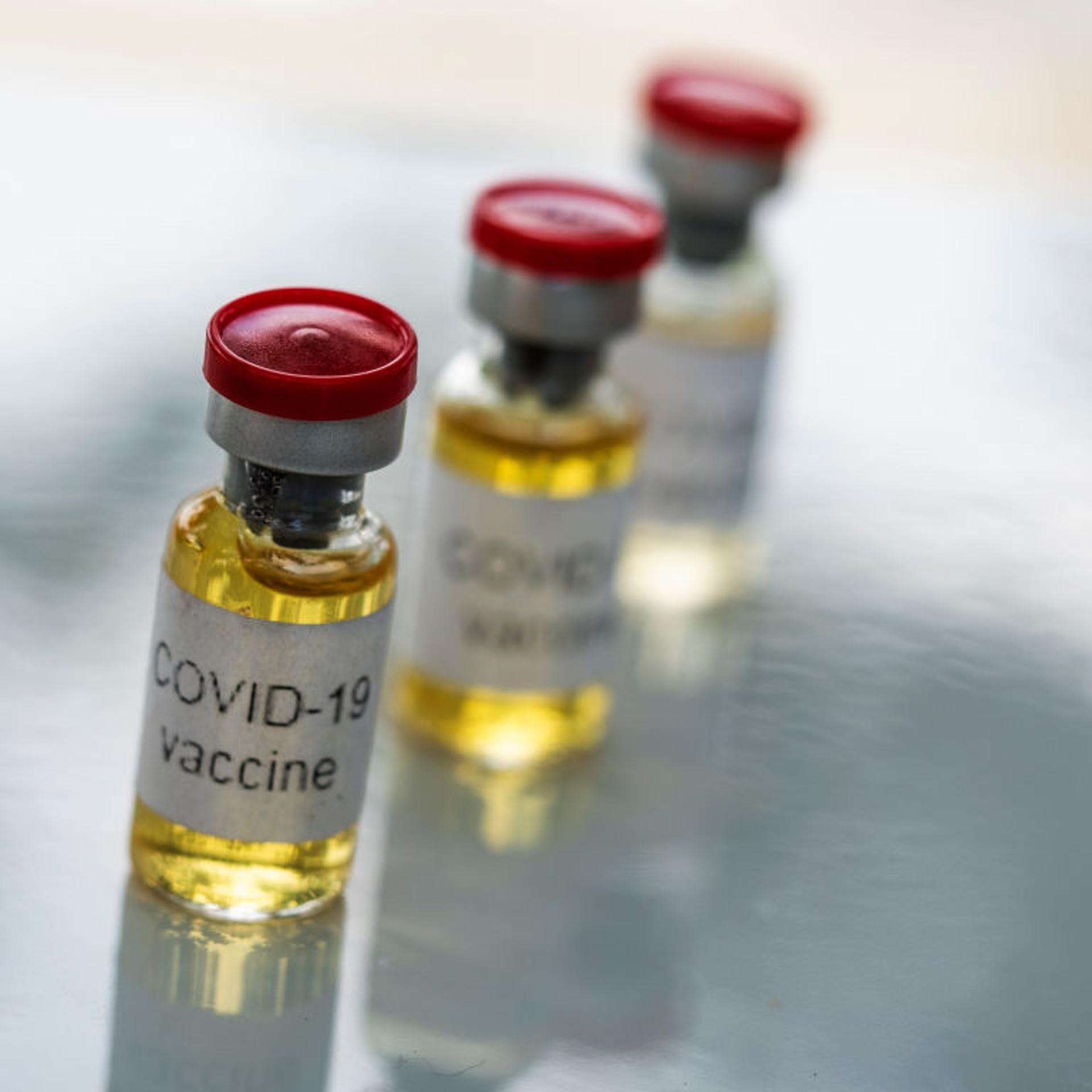 In this photo illustration, fake vials labelled 'Covid-19