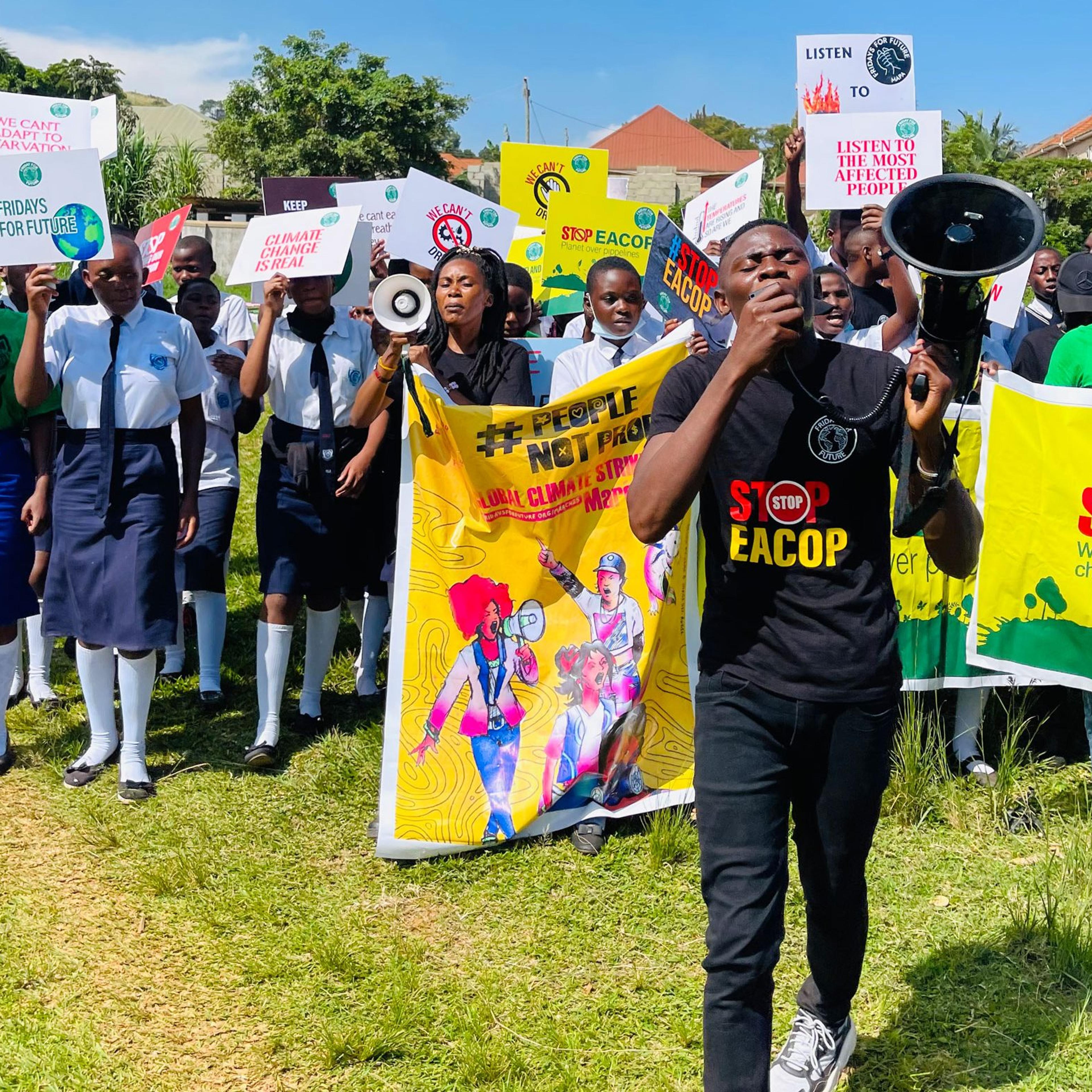 Nyombi Morris leads a protest against the 'East African Crude Oil Pipeline' project on March 25, 2022 at Mutundwe Young Christian Secondary School in Kirinyabigo, Kampala Uganda.