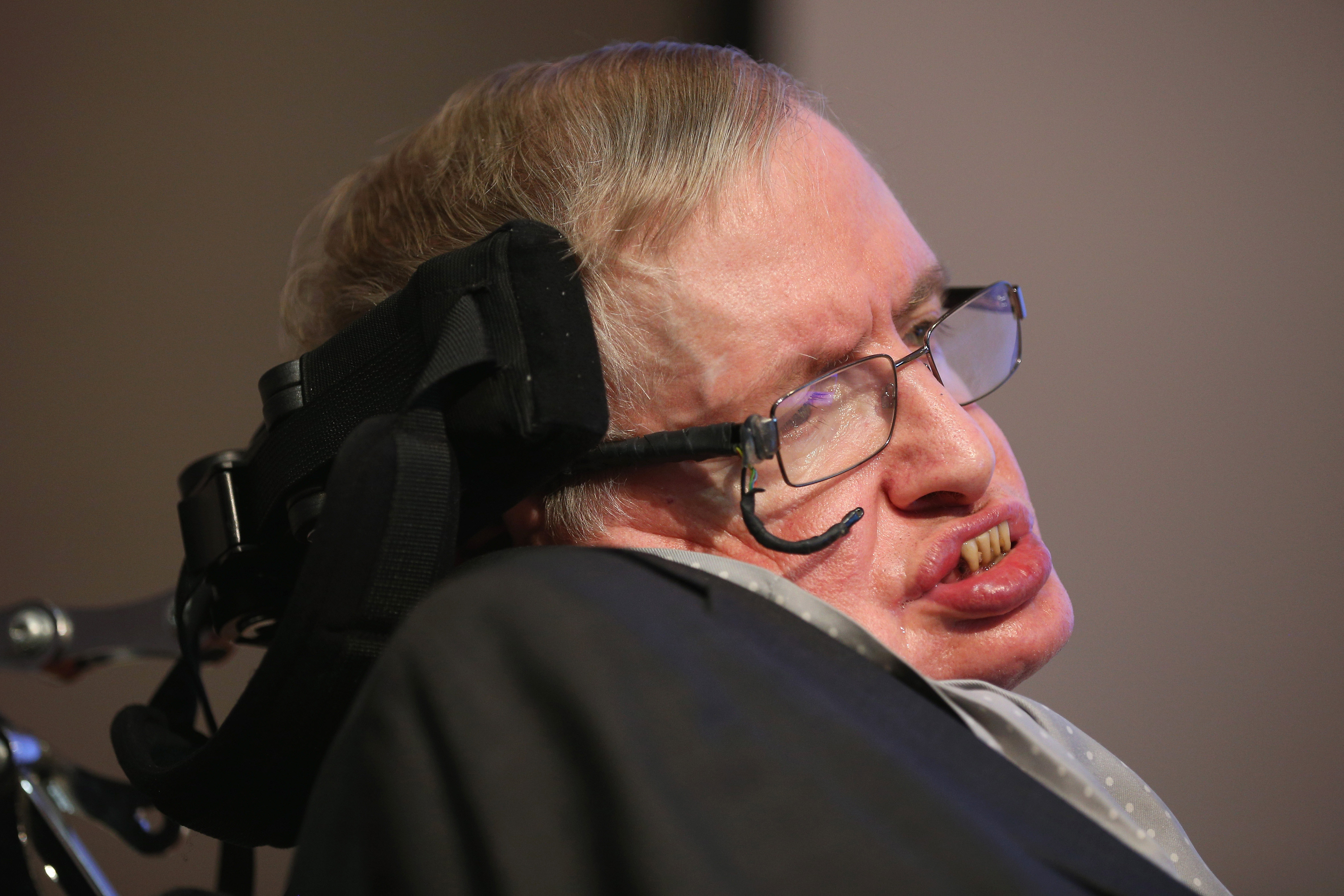 Theoretical Physicist Professor Stephen Hawking sits on stage on December 16, 2015 in London, England.