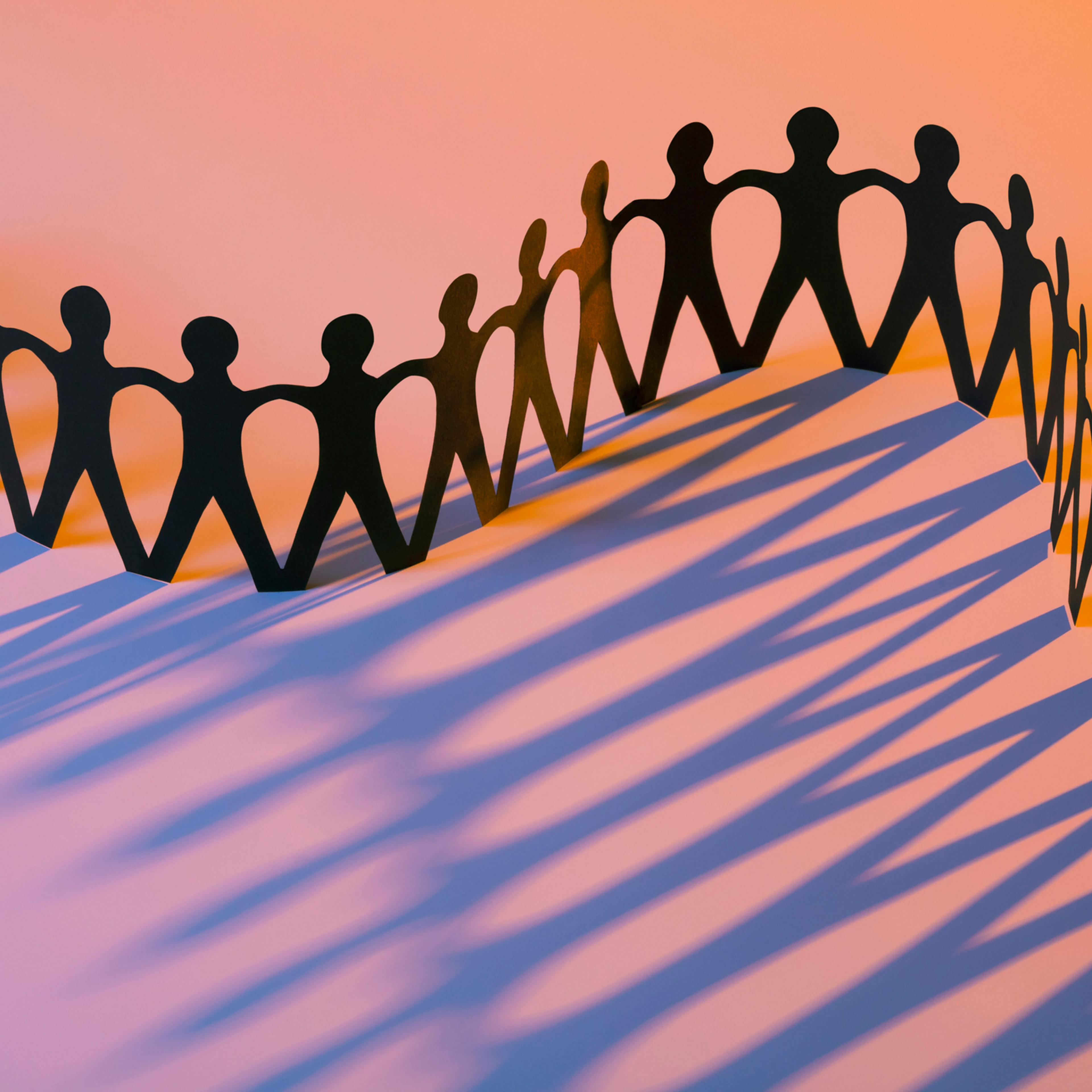 Paper Men Joining Together As Team, Union, Family or Network