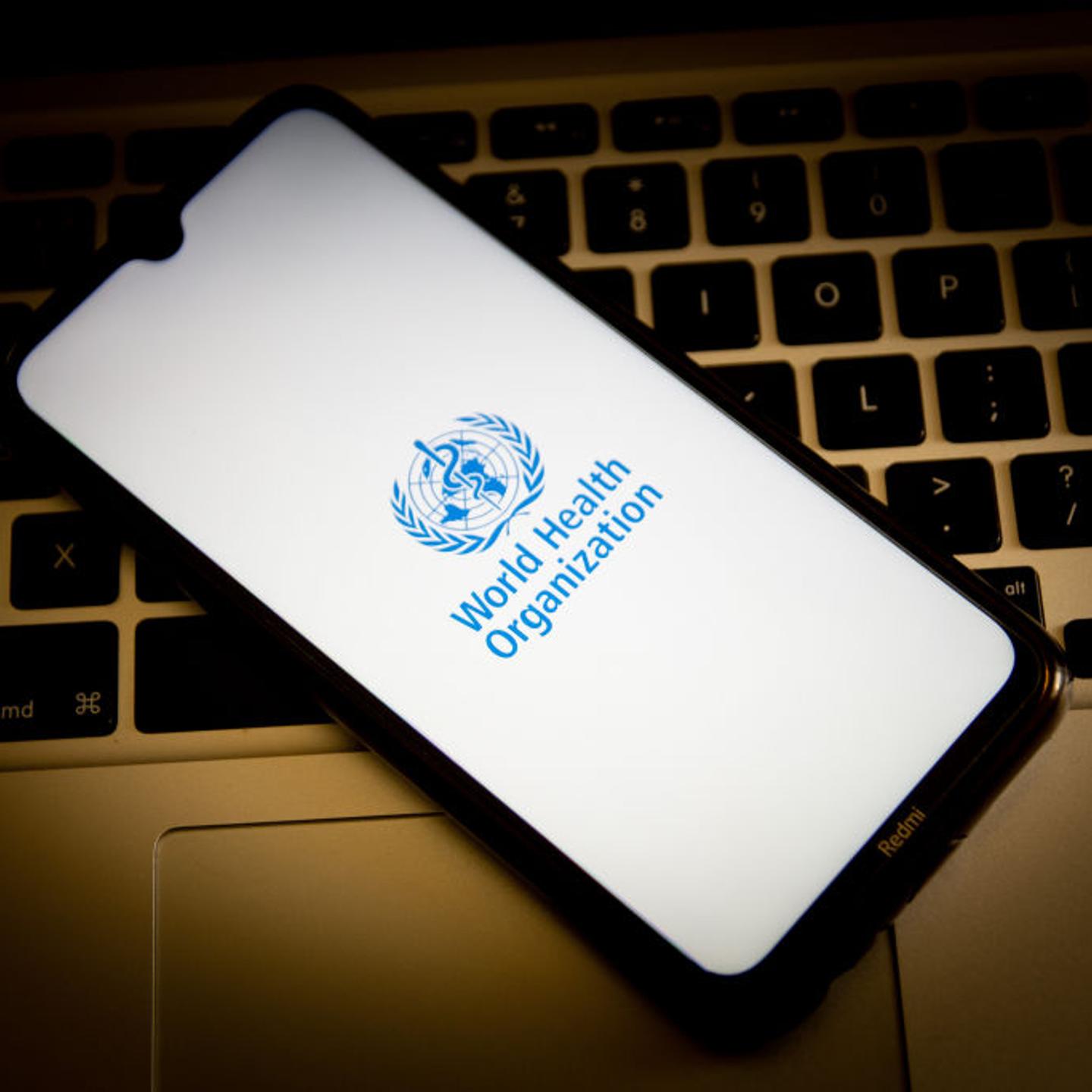 In this photo illustration, a World Health Organization logo