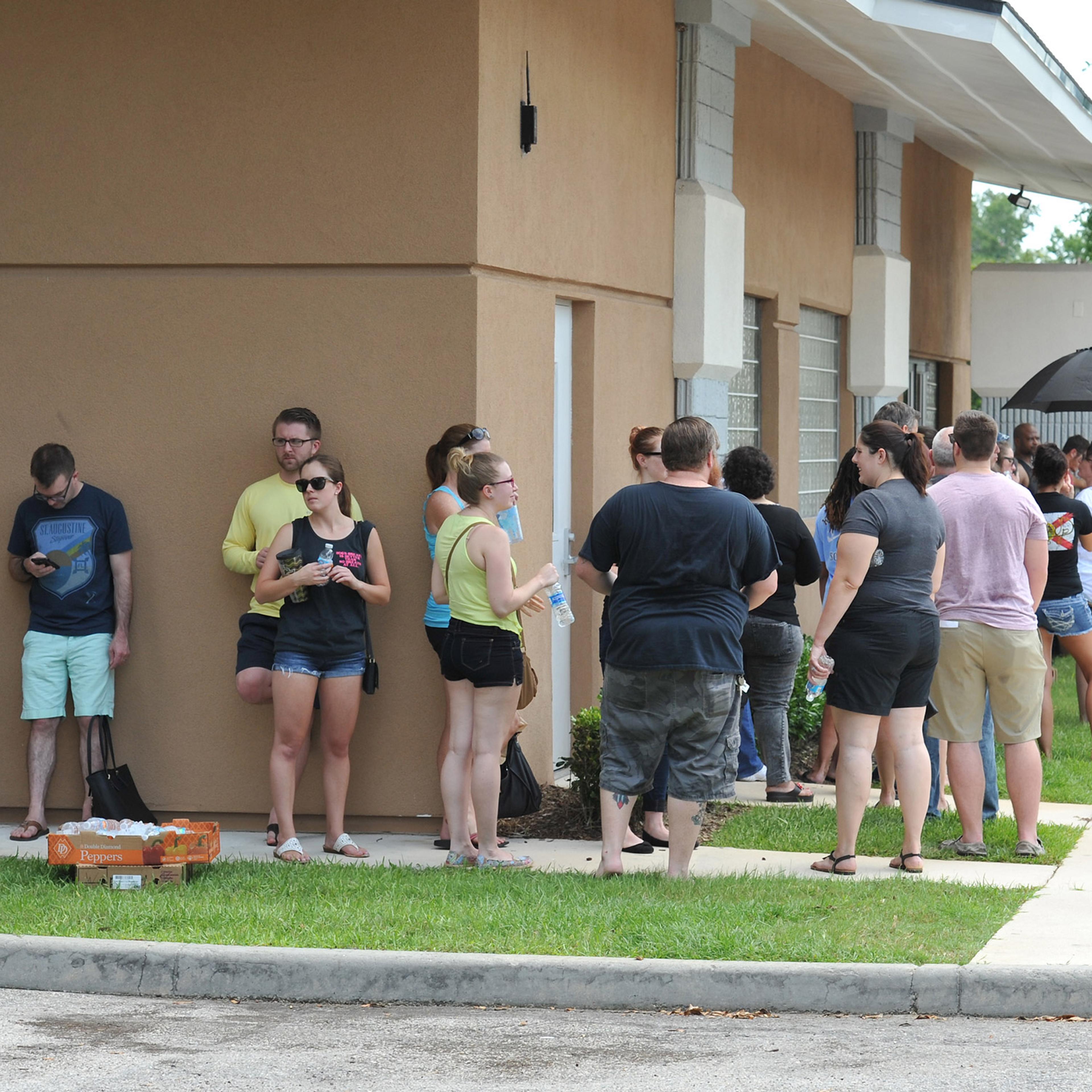 Potential blood donors line up outside the oneblood facility on Beach Blvd. In Jacksonville, Fla., Sunday, June 12, 2016, to help the victims from the shooting at a nightclub in Orlando. A gunman wielding an assault-type rifle and a handgun opened fire i
