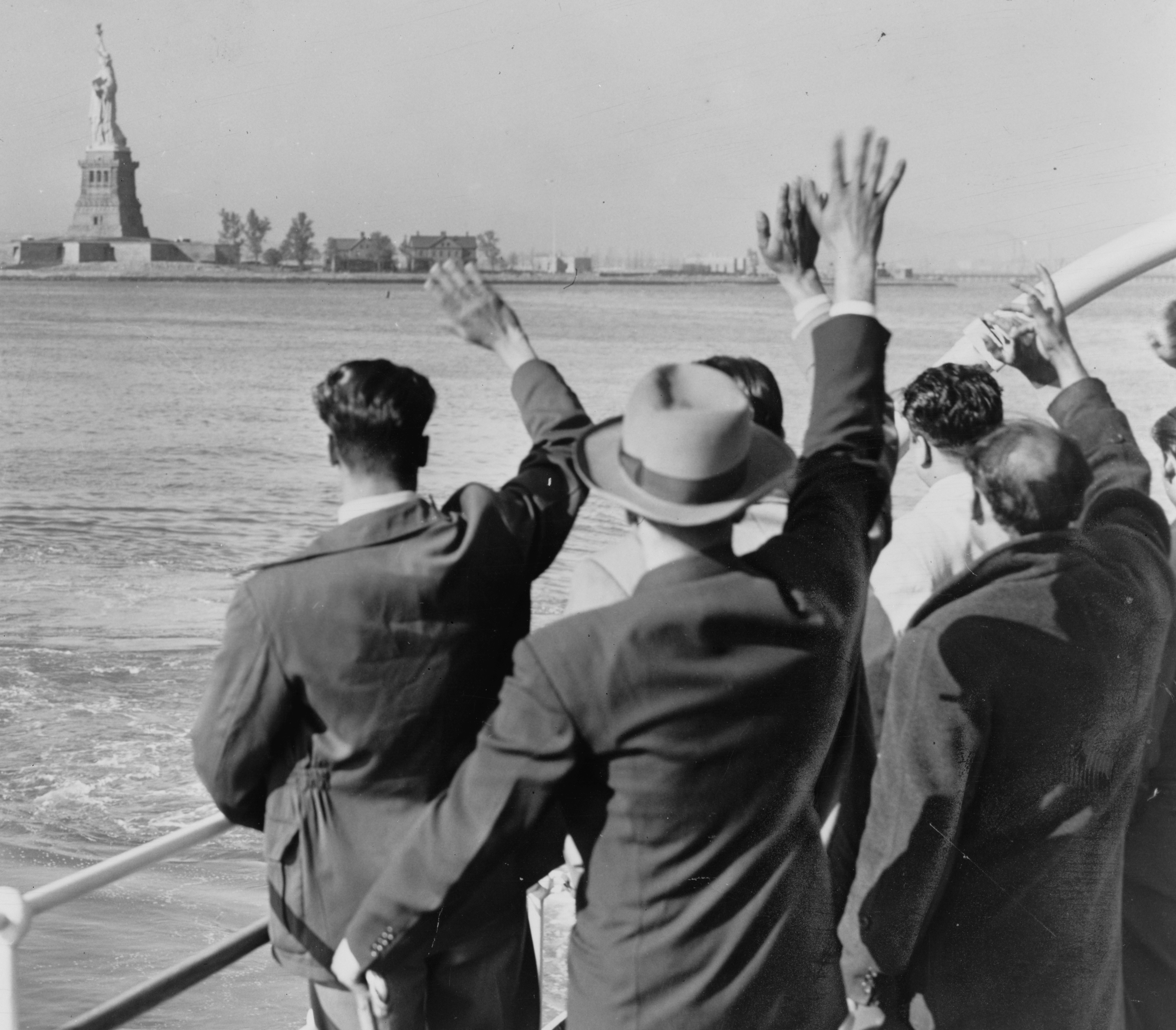 Deported Group Waves Goodbye to the Statue of Liberty
