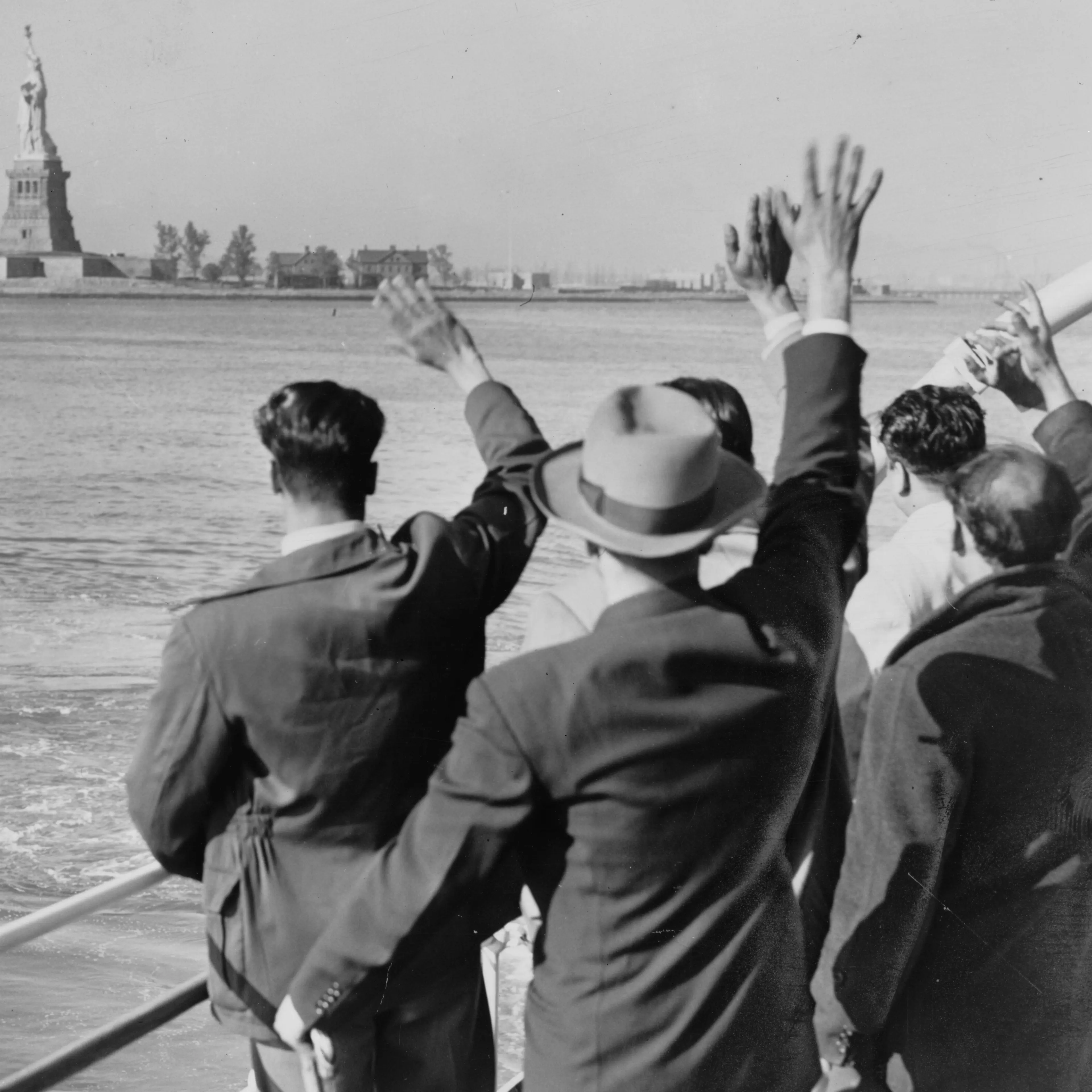 Deported Group Waves Goodbye to the Statue of Liberty