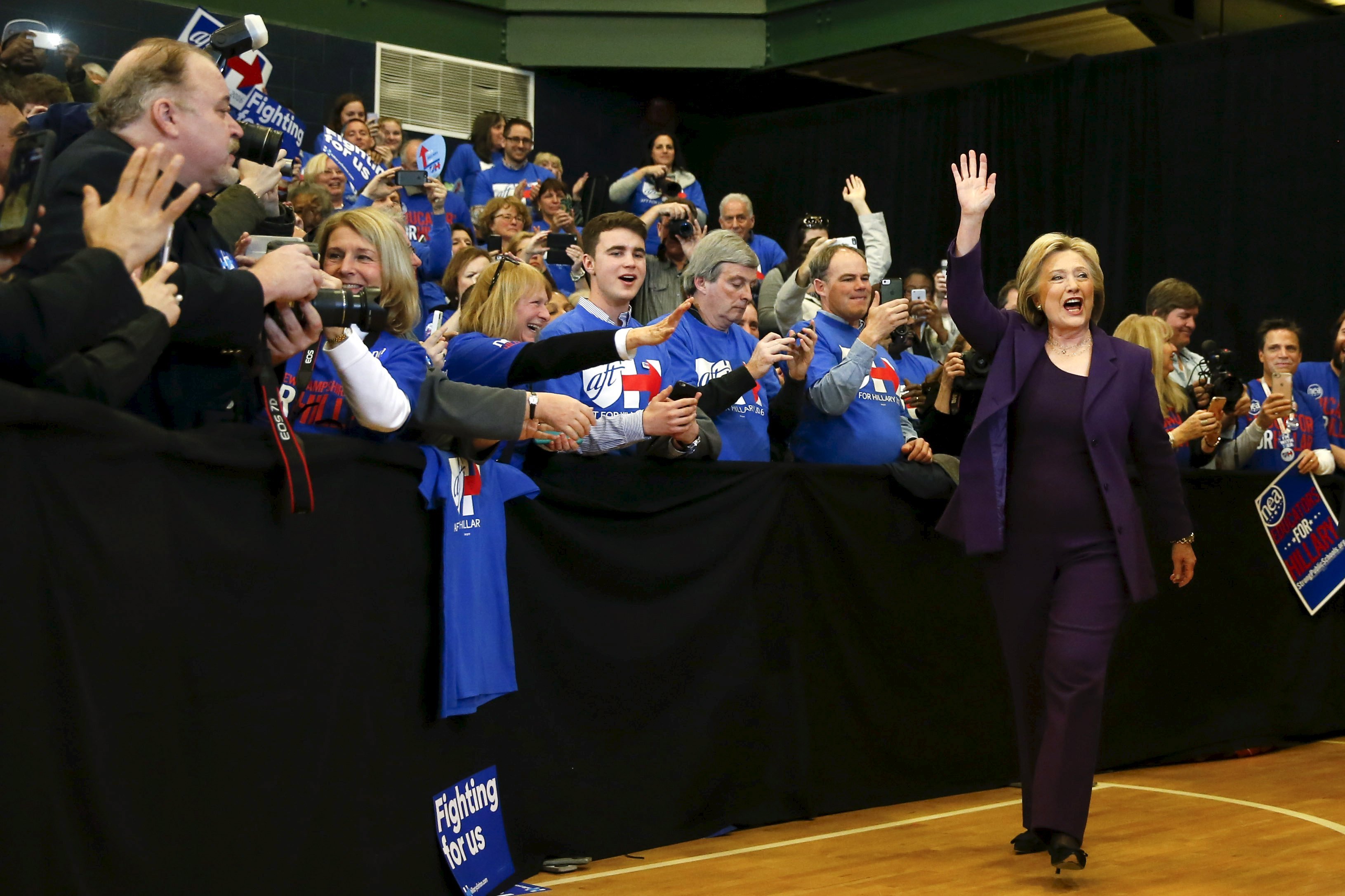 U.S. Democratic presidential candidate Hillary Clinton waves as she arrives to lead a campaign rally at Nashua Community College, in Nashua, New Hampshire