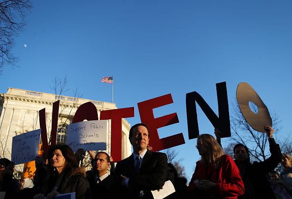 Protestors demonstrate against President Trump's nominee for secretary of education, Betsy DeVos, on Capitol Hill on February 6, 2017 in Washington, DC.