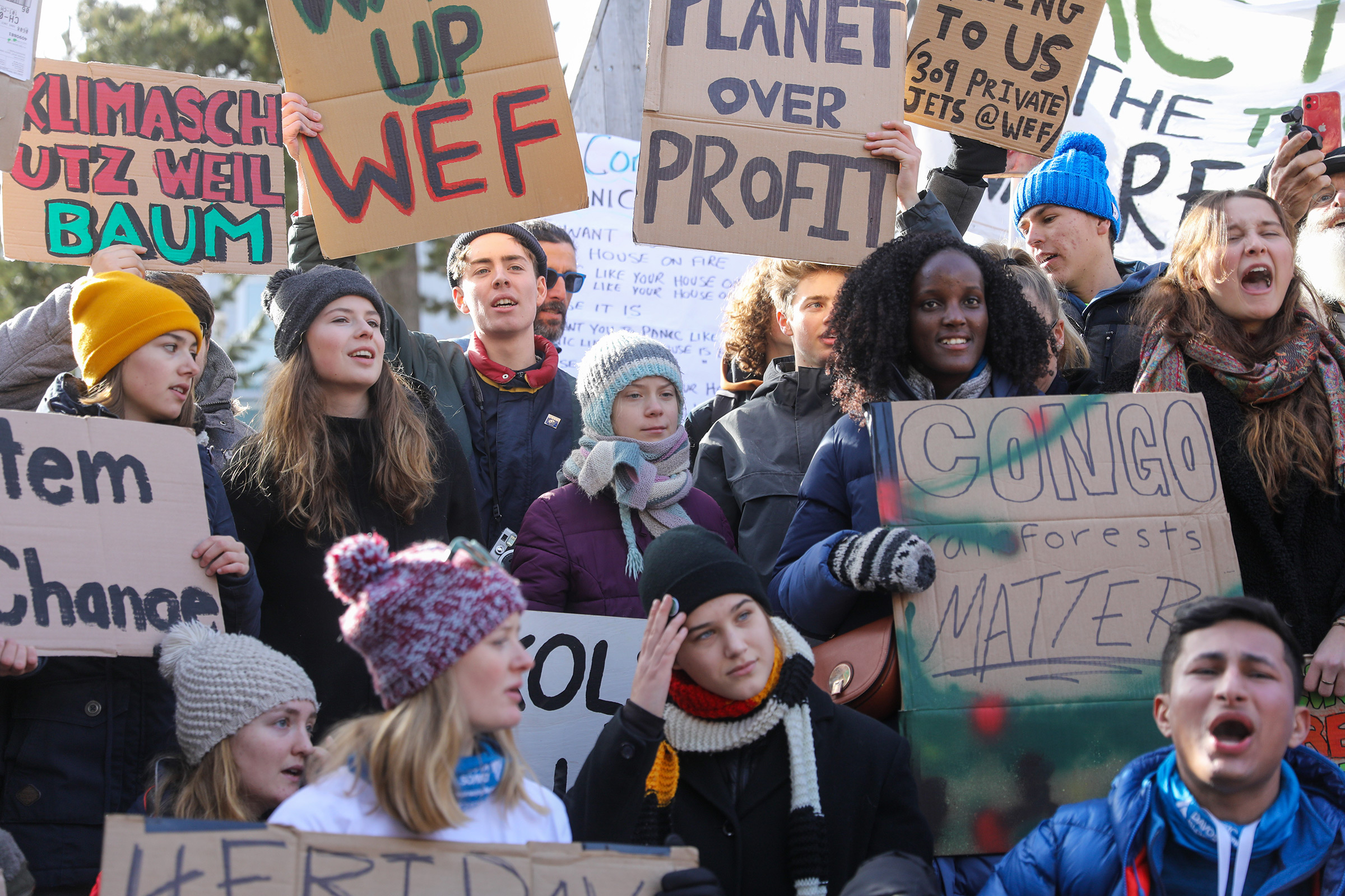 Climate activist Isabelle Axelsson, bottom third left, takes part in a demonstration on the closing day of the World Economic Forum Davos, Switzerland, on Jan. 24, 2020.