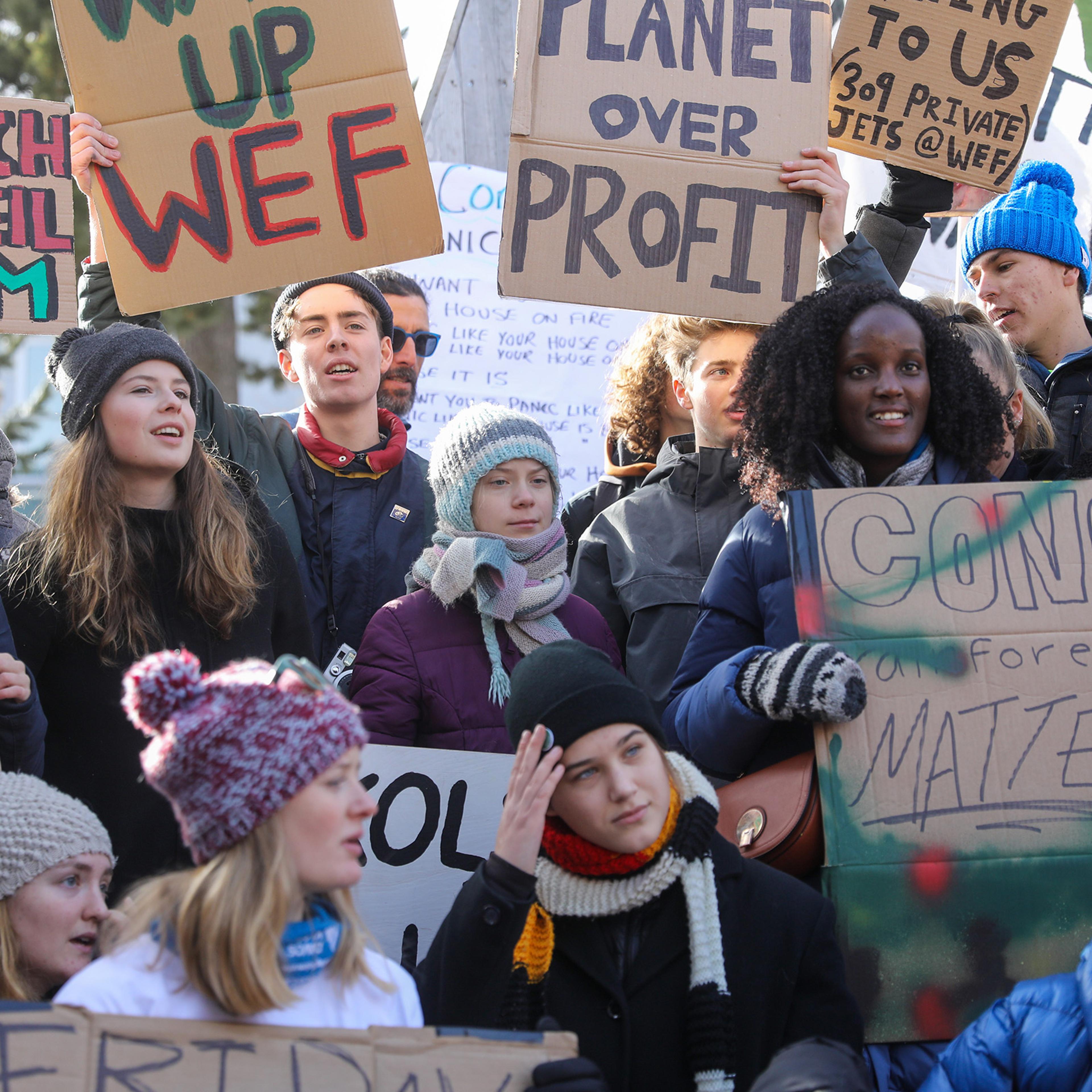 Climate activist Isabelle Axelsson, bottom third left, takes part in a demonstration on the closing day of the World Economic Forum Davos, Switzerland, on Jan. 24, 2020.