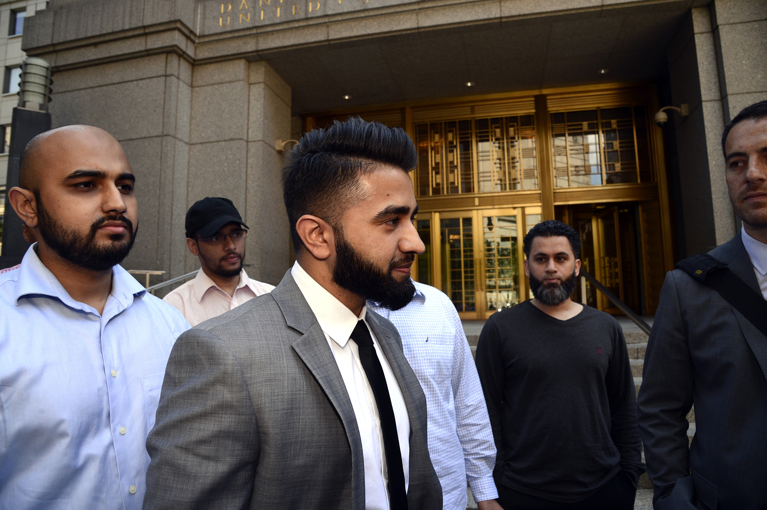 New York Police Department officer Masood Syed, center, leaves Manhattan Federal Court on June 22, 2016. Sayed, a Sunni Muslim, filed a lawsuit against the city for suspending him from the force over the length of his beard.