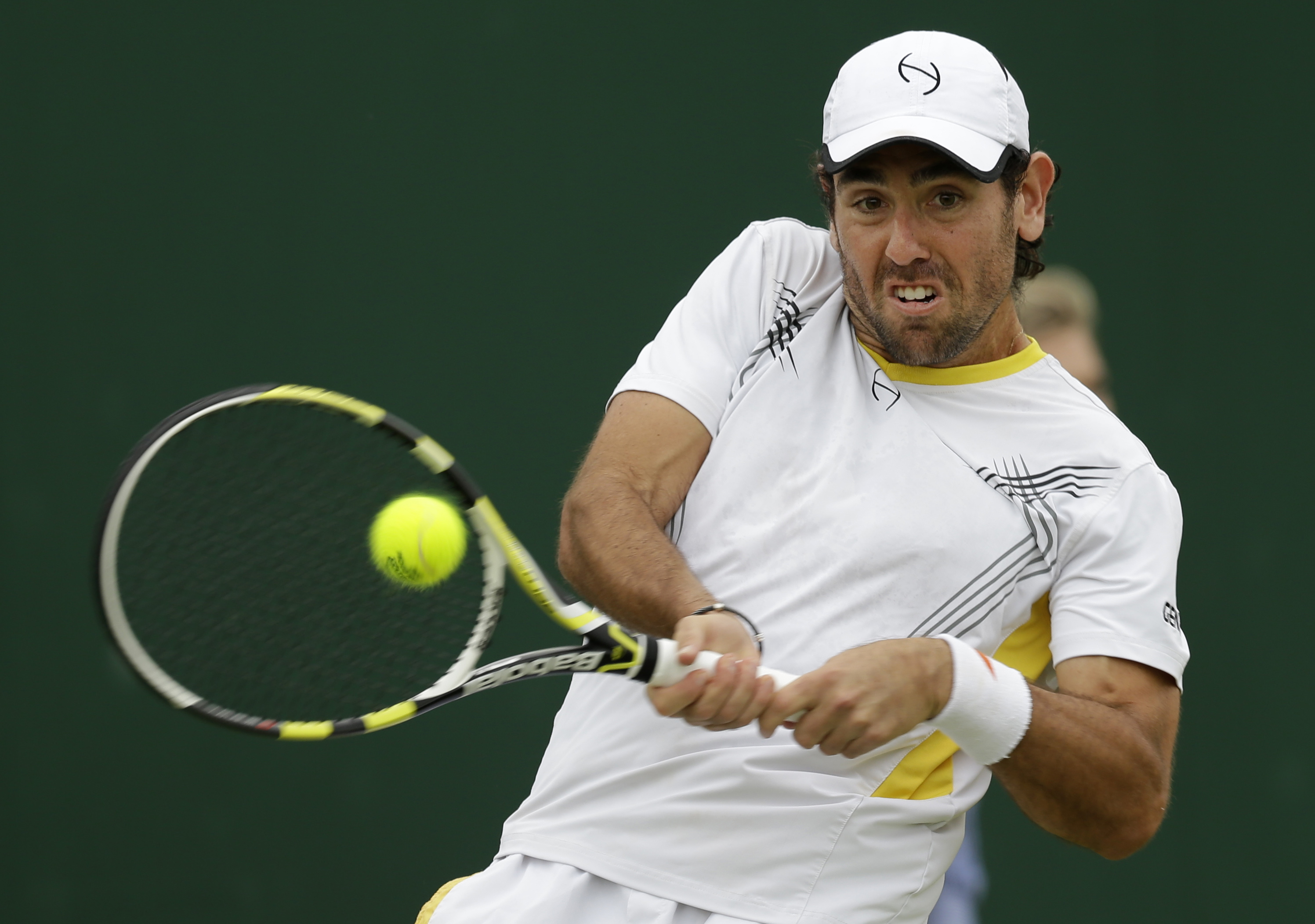 FILE - In this Wednesday, June 27, 2012 file photo, Wayne Odesnik of the United States returns a shot during a first round men's singles match against Bjorn Phau of Germany at the All England Lawn Tennis Championships at Wimbledon, England. The Internati