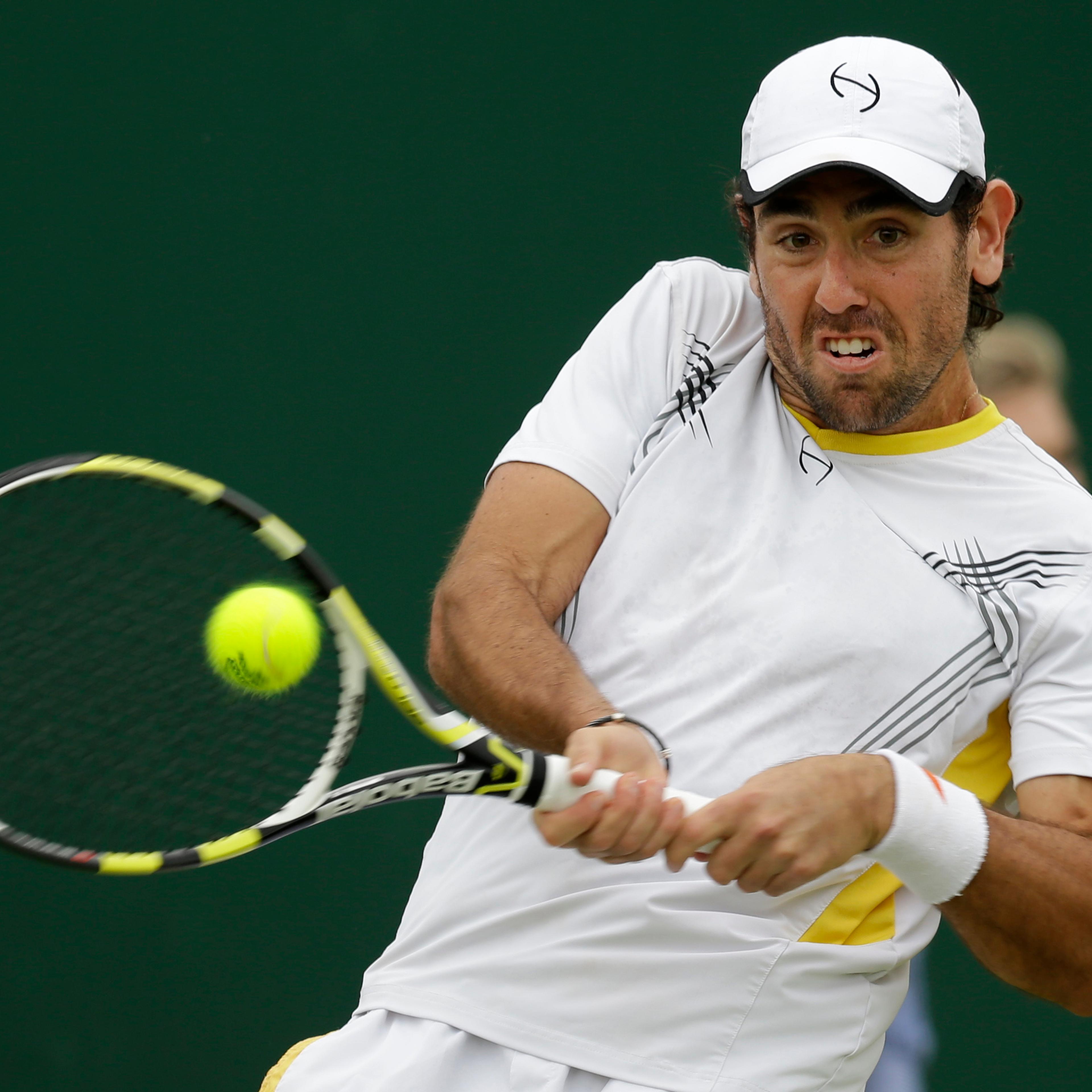 FILE - In this Wednesday, June 27, 2012 file photo, Wayne Odesnik of the United States returns a shot during a first round men's singles match against Bjorn Phau of Germany at the All England Lawn Tennis Championships at Wimbledon, England. The Internati