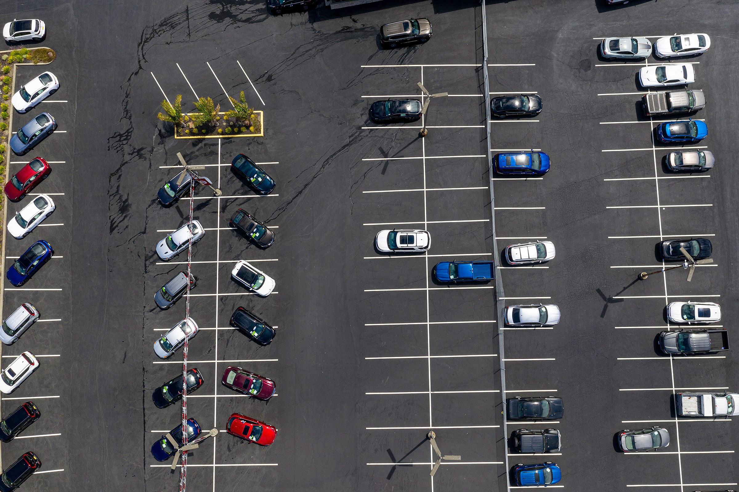 Vehicles in a nearly empty lot at a car dealership in Richmond, Calif., on July 1, 2021.