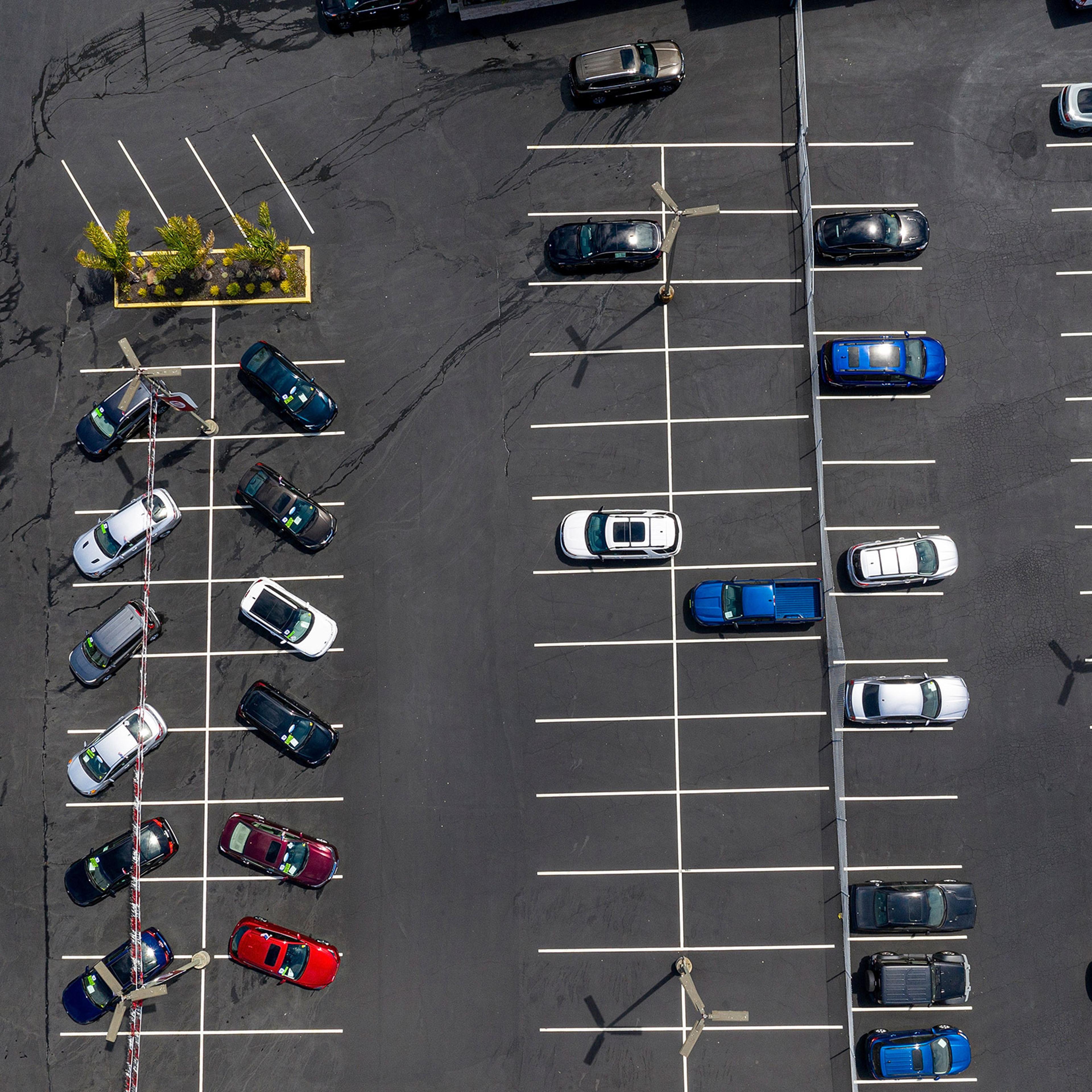 Vehicles in a nearly empty lot at a car dealership in Richmond, Calif., on July 1, 2021.
