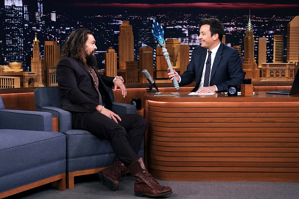 THE TONIGHT SHOW STARRING JIMMY FALLON -- Episode 0976 -- Pictured: (l-r) Actor Jason Momoa is given a toy trident by host Jimmy Fallon during their interview on December 6, 2018