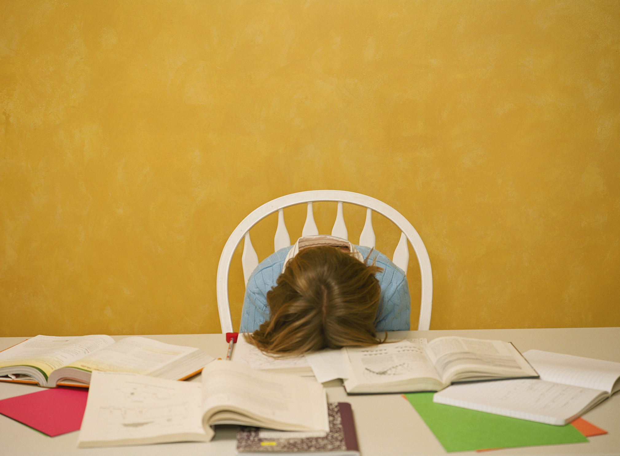 Exhausted Girl with Homework
