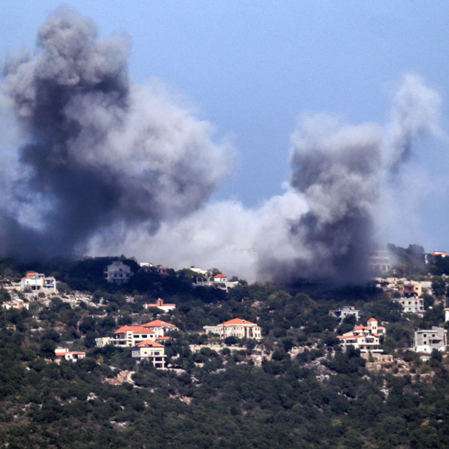 A cloud of smoke erupts during an Israeli air strike on the village of Sujud in southern Lebanon on Sept. 25, 2024.