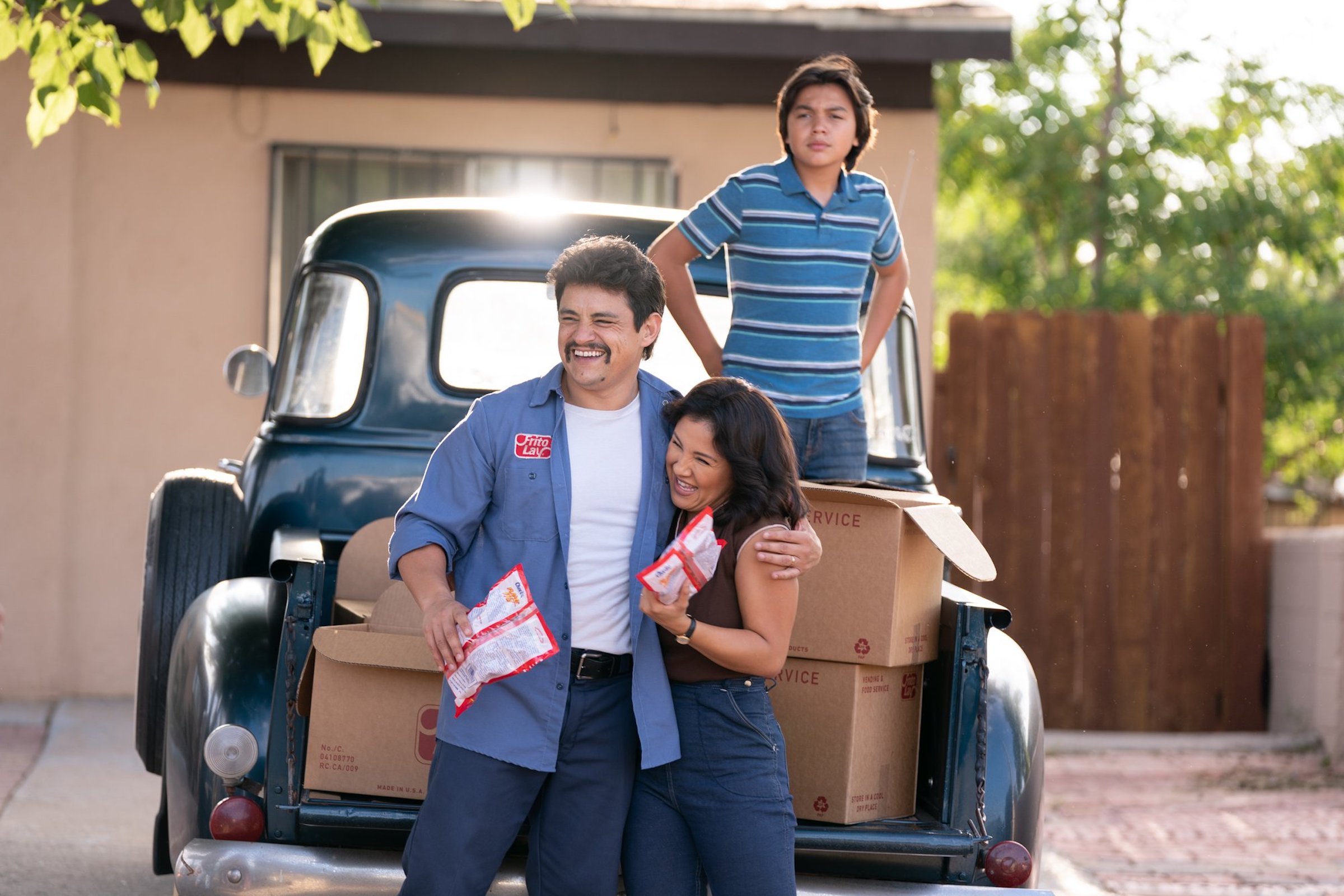 Richard (Jesse Garcia), Judy (Annie Gonzalez), and their son Lucky (Hunter Jones) in <em>Flamin' Hot</em>.