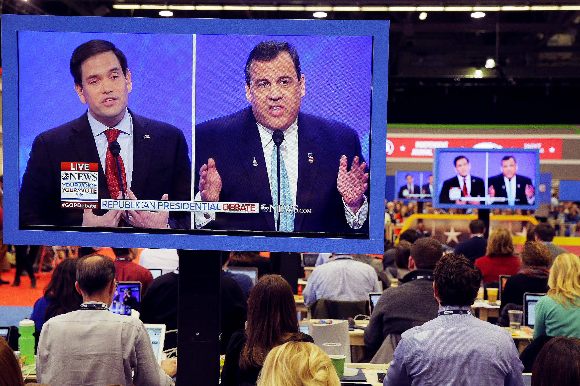 Republican presidential candidates Sen. Marco Rubio (r-FL) and New Jersey Gov. Chris Christie are seen on press room television monitors during a Republican presidential debate on Feb. 6, 2016 at Saint Anselm College in Manchester, N.H.