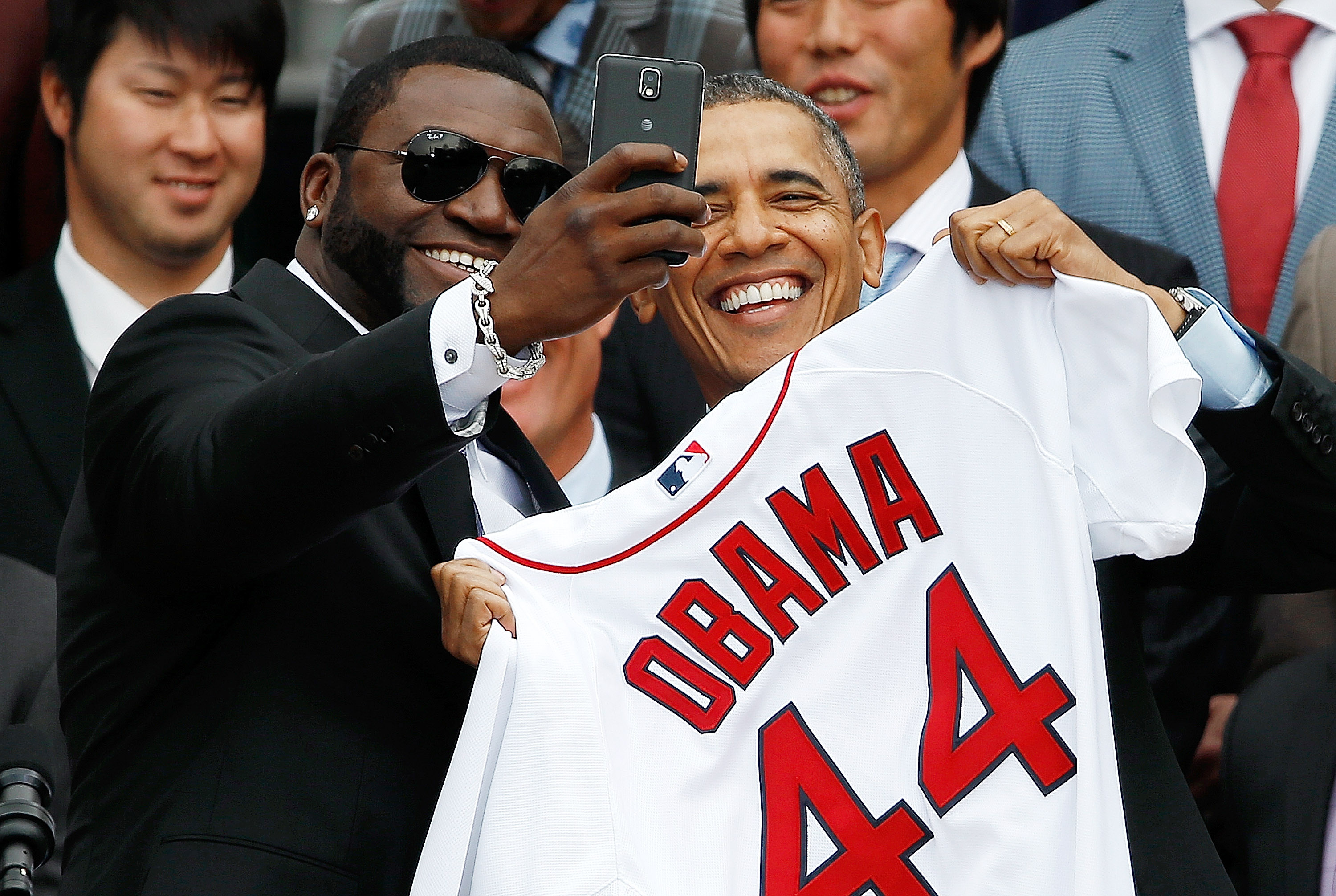 WASHINGTON, DC - APRIL 01: Boston Red Sox designated hitter David Ortiz (L) poses for a "selfie" with U.S. President Barack Obama during a ceremony on the South Lawn of the White House to honor the 2013 World Series Champion Boston Red Sox April 1, 2014 
