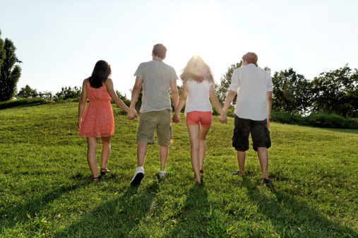 young-adults-walking-holding-hands