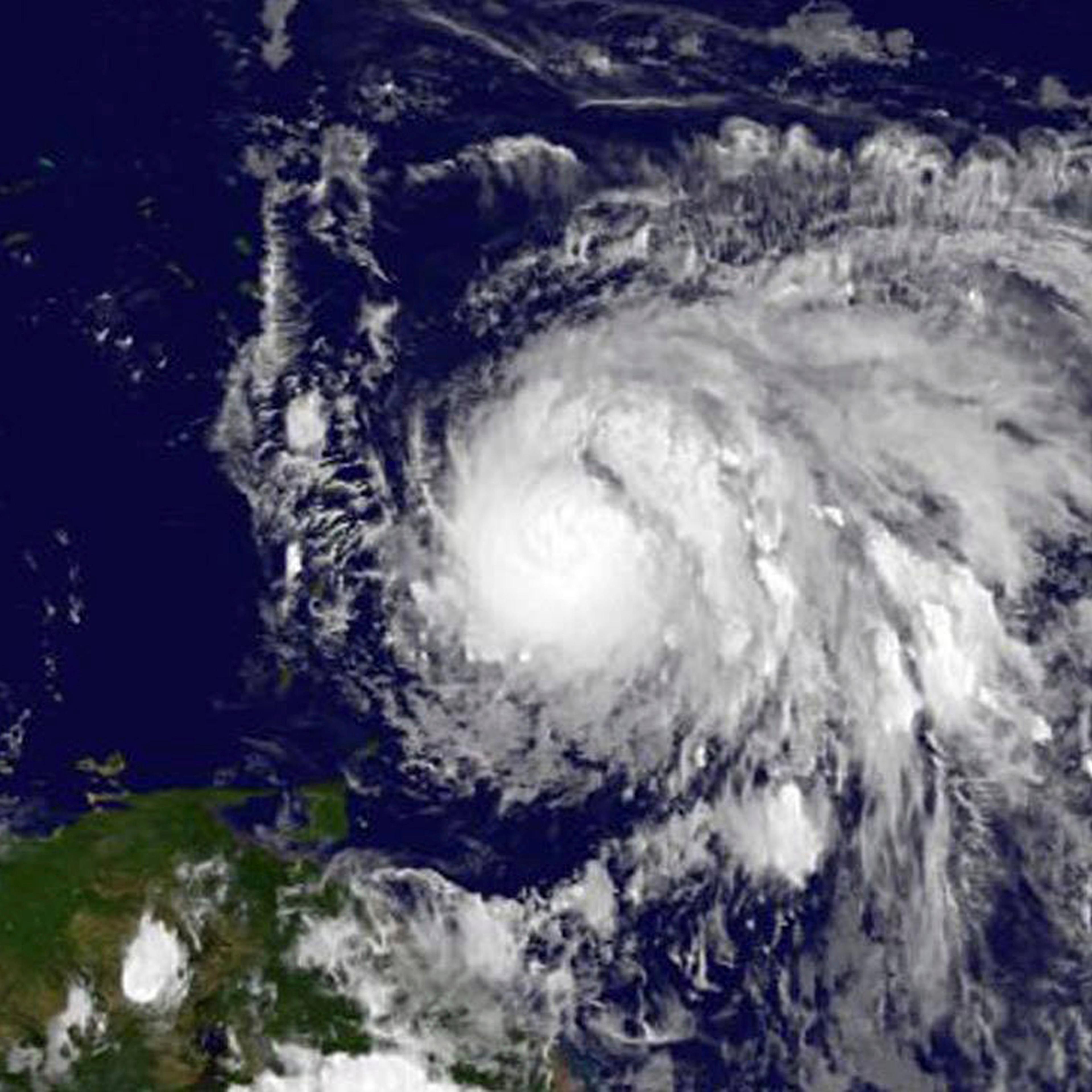 Sept. 17, 2017, GOES East satellite image provided by NASA taken at 7:45 p.m EDT, shows Hurricane Maria as it approaches the Lesser Antilles. Maria swiftly grew into a hurricane Sunday, and forecasters said it was expected to become much stronger over th