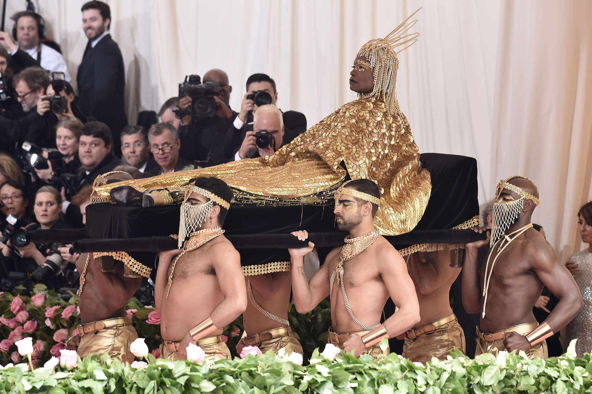 billy porter gold dress Billy Porter shut down the Met Gala red carpet in a dazzling gold bodysuit  and matching cape, inspired by Egyptian royalty. His entrancecarried in by  six shirtless menwas just as iconic as