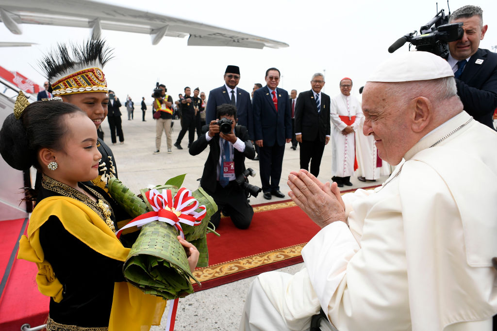 Pope Francis is welcomed as he arrives at Jakarta Soekarno-Hatta International Airport in Jakarta, Indonesia, on Sept. 3, 2024.