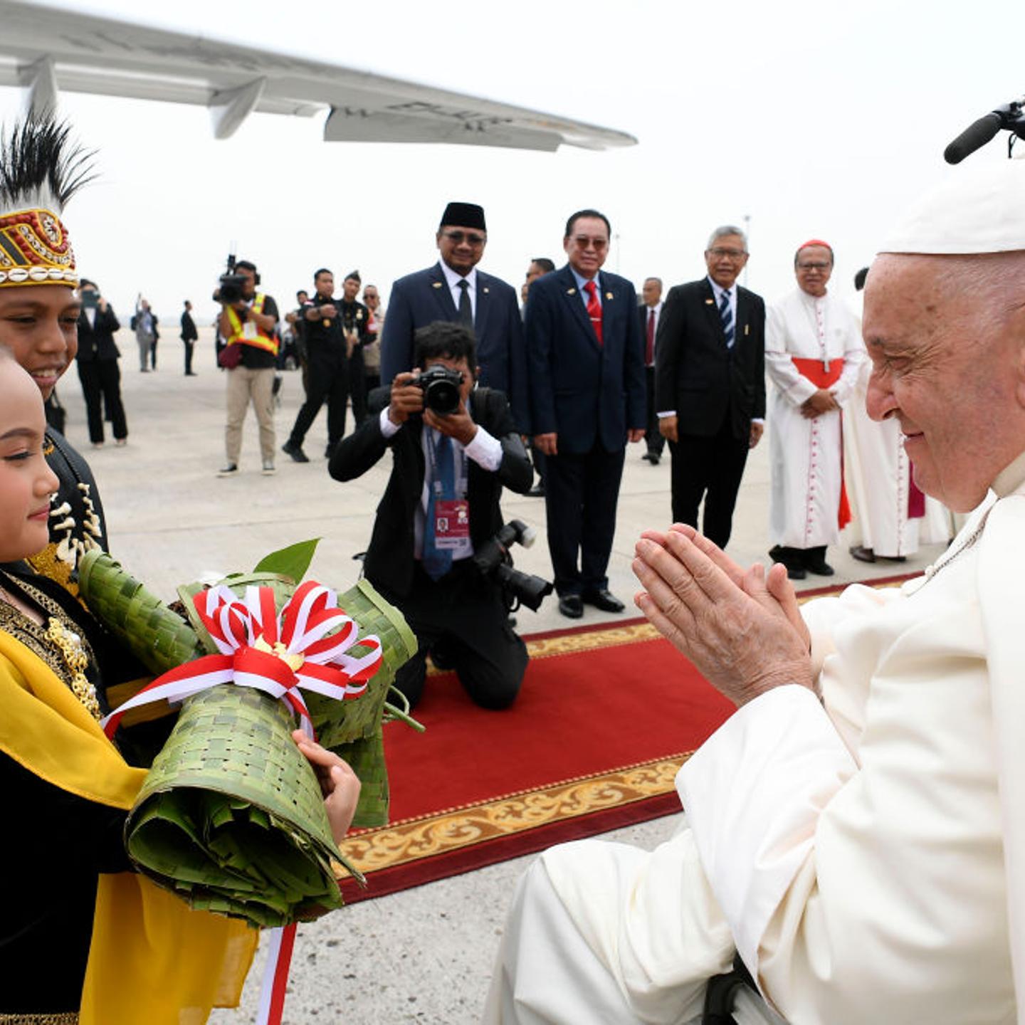 Pope Francis is welcomed as he arrives at Jakarta Soekarno-Hatta International Airport in Jakarta, Indonesia, on Sept. 3, 2024.