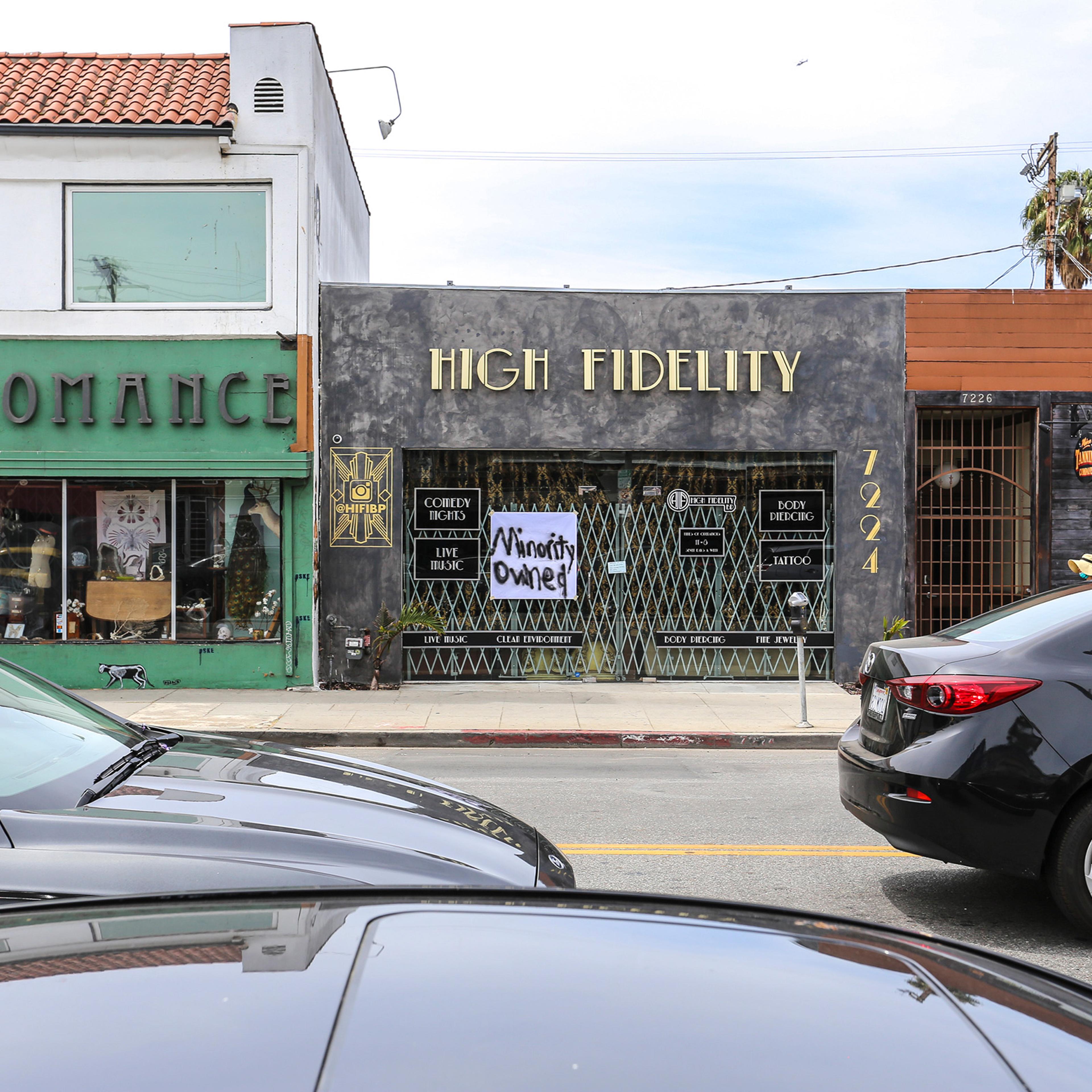 High Fidelity, a black owned business on Melrose Avenue, Los Angeles, displays a "Minority Owned" sign on May 31