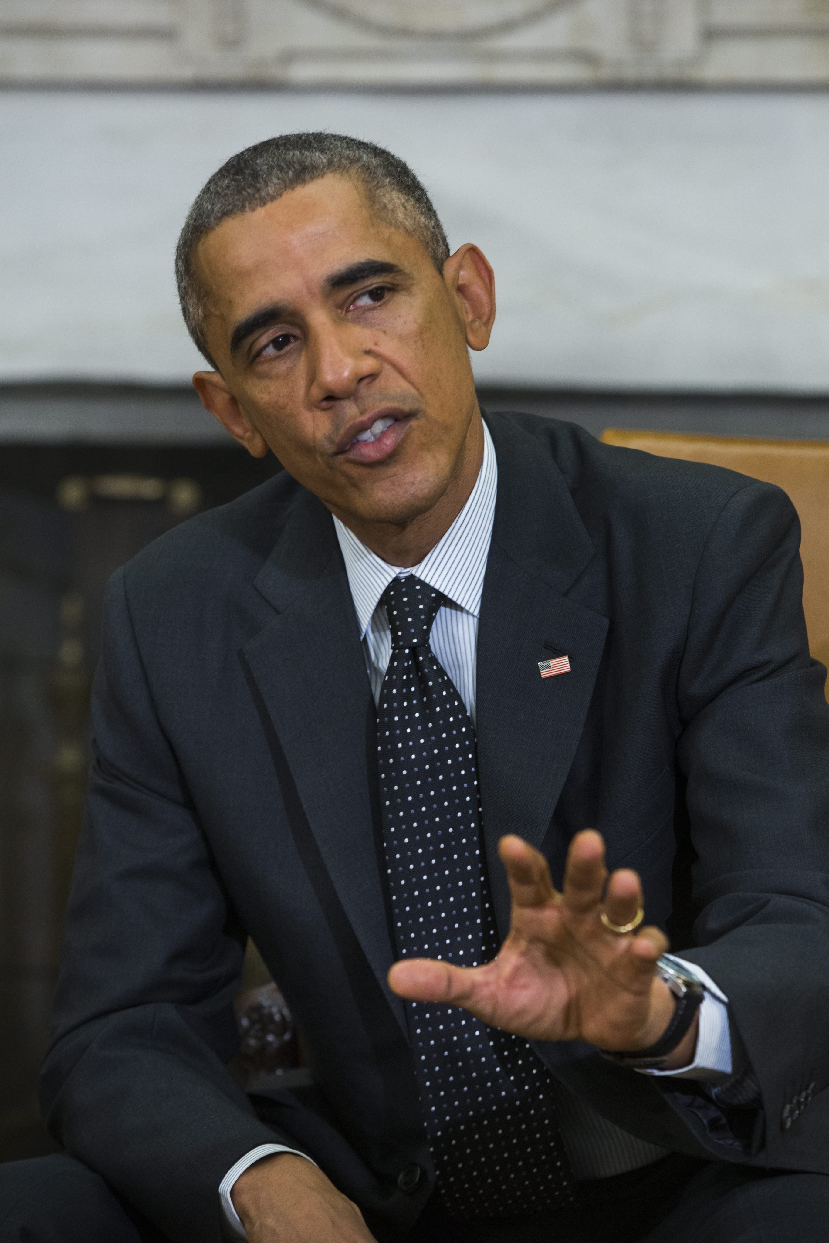 President Barack Obama speaks to the media after holding a meeting with his newly-appointed 'Ebola Response Coordinator' Ron Klain, along with other members of the team coordinating the Obama administration's ebola response efforts, in the Oval Office of