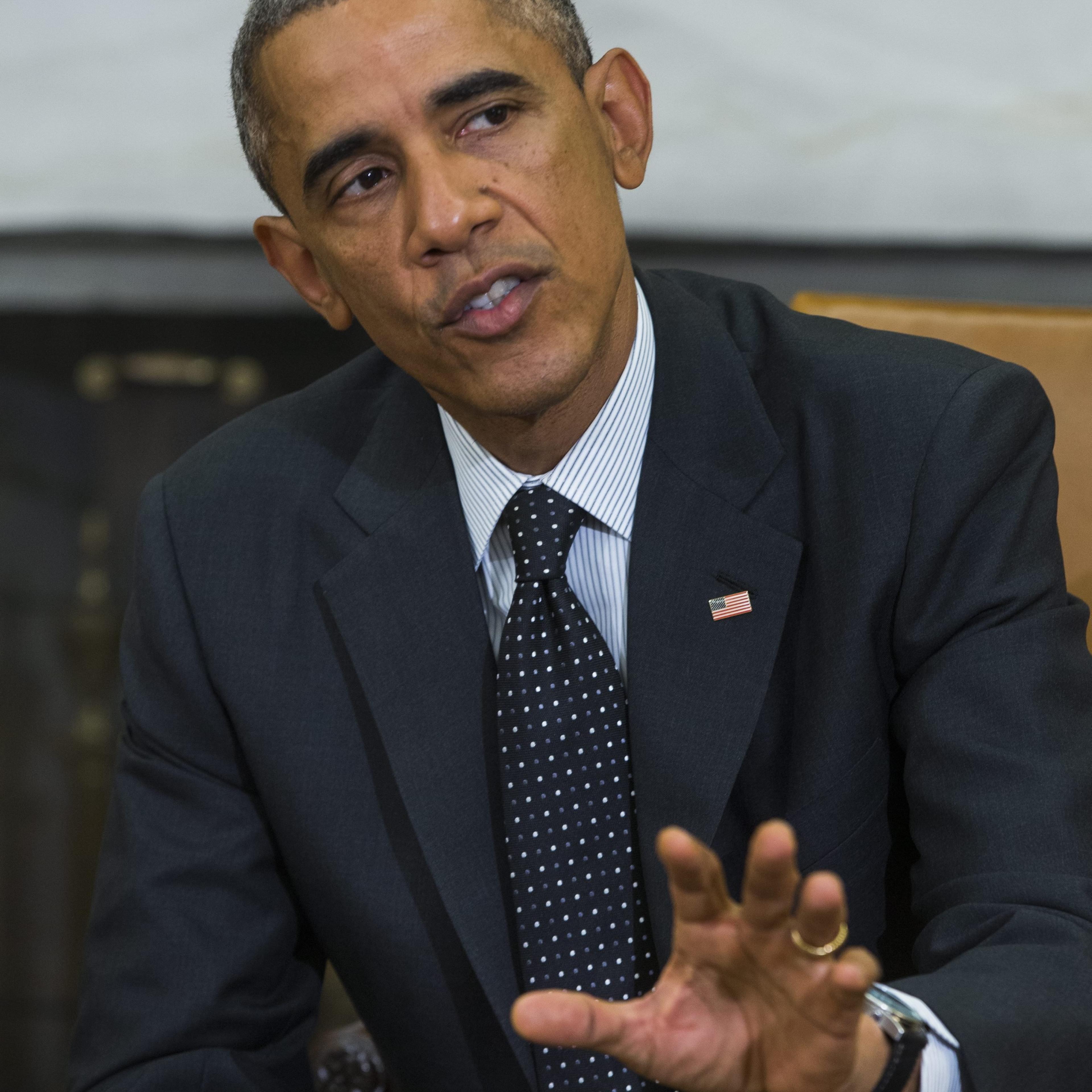 President Barack Obama speaks to the media after holding a meeting with his newly-appointed 'Ebola Response Coordinator' Ron Klain, along with other members of the team coordinating the Obama administration's ebola response efforts, in the Oval Office of