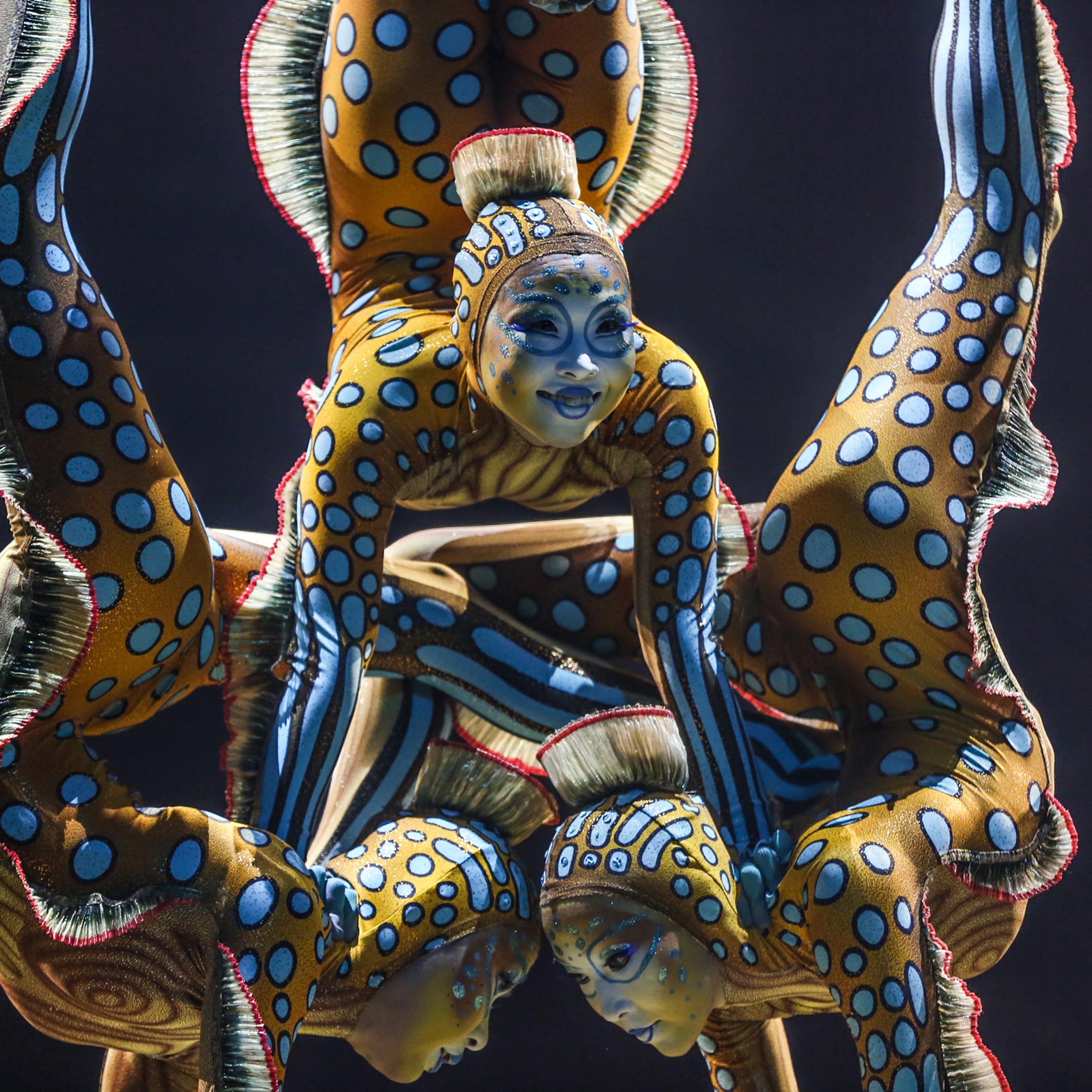 Cast members from Cirque du Soleil perform on stage during the LA Premiere of Cirque du Soleil's "KURIOS - Cabinet of Curiosities" at Dodger Stadium on Wednesday, Dec. 9, 2015, in Los Angeles. (Photo by Rich Fury/Invision/AP)
