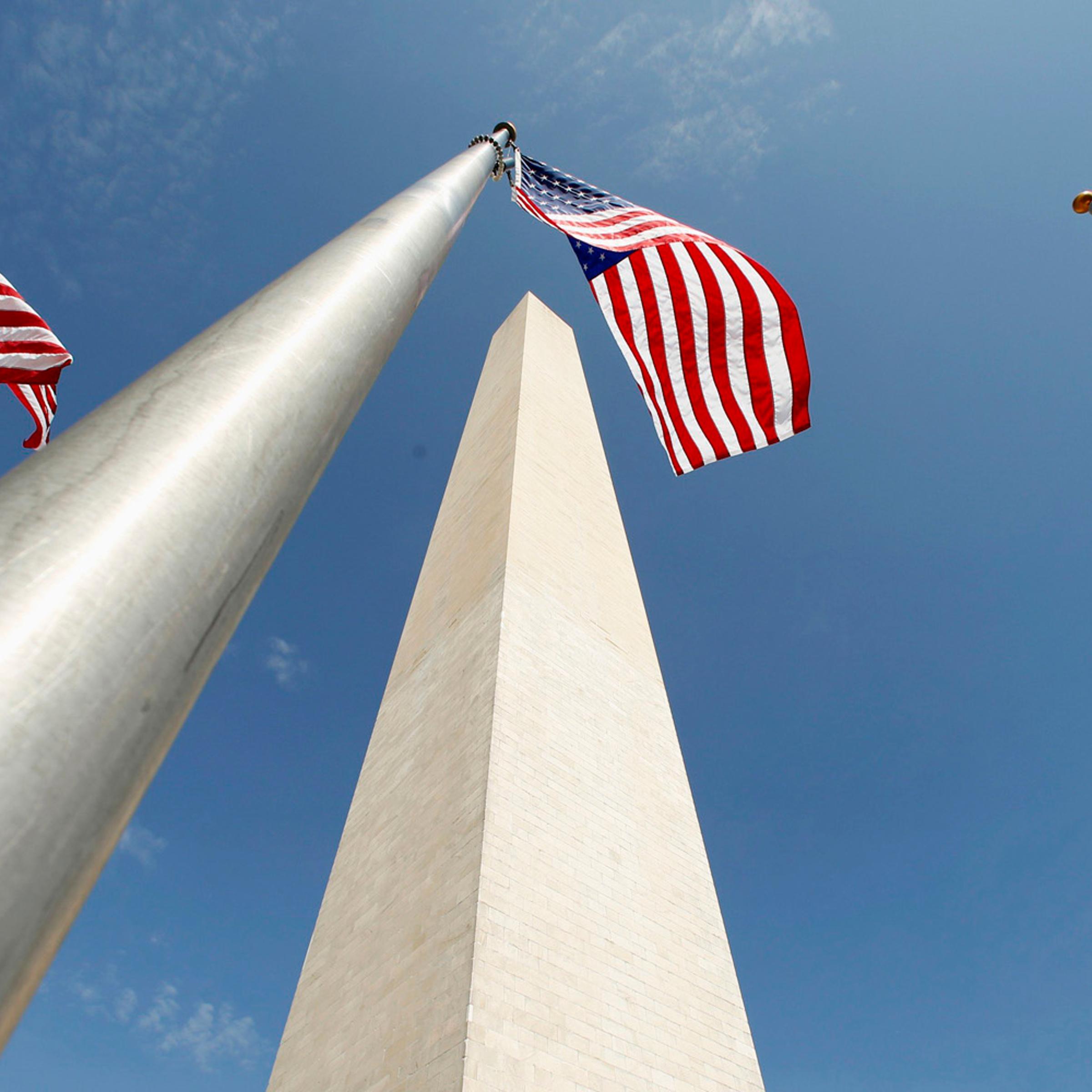 Flags flutter during re-opening ceremony for Washington Monument in Washington