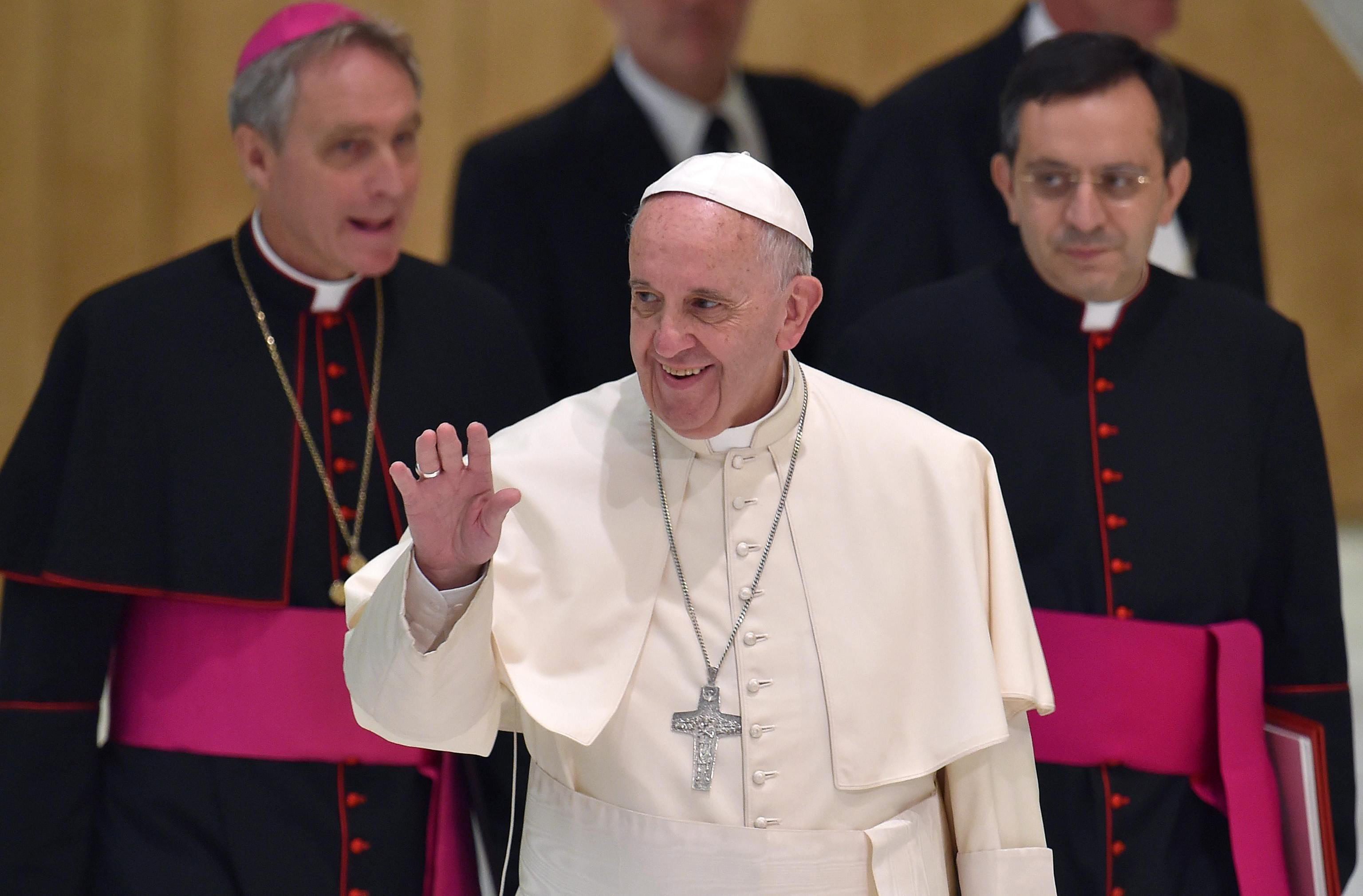 Pope Francis arrives for an audience with members of the Eucharistic Youth Movement in the Paul VI hall at the Vatican City on Aug. 7 2015.