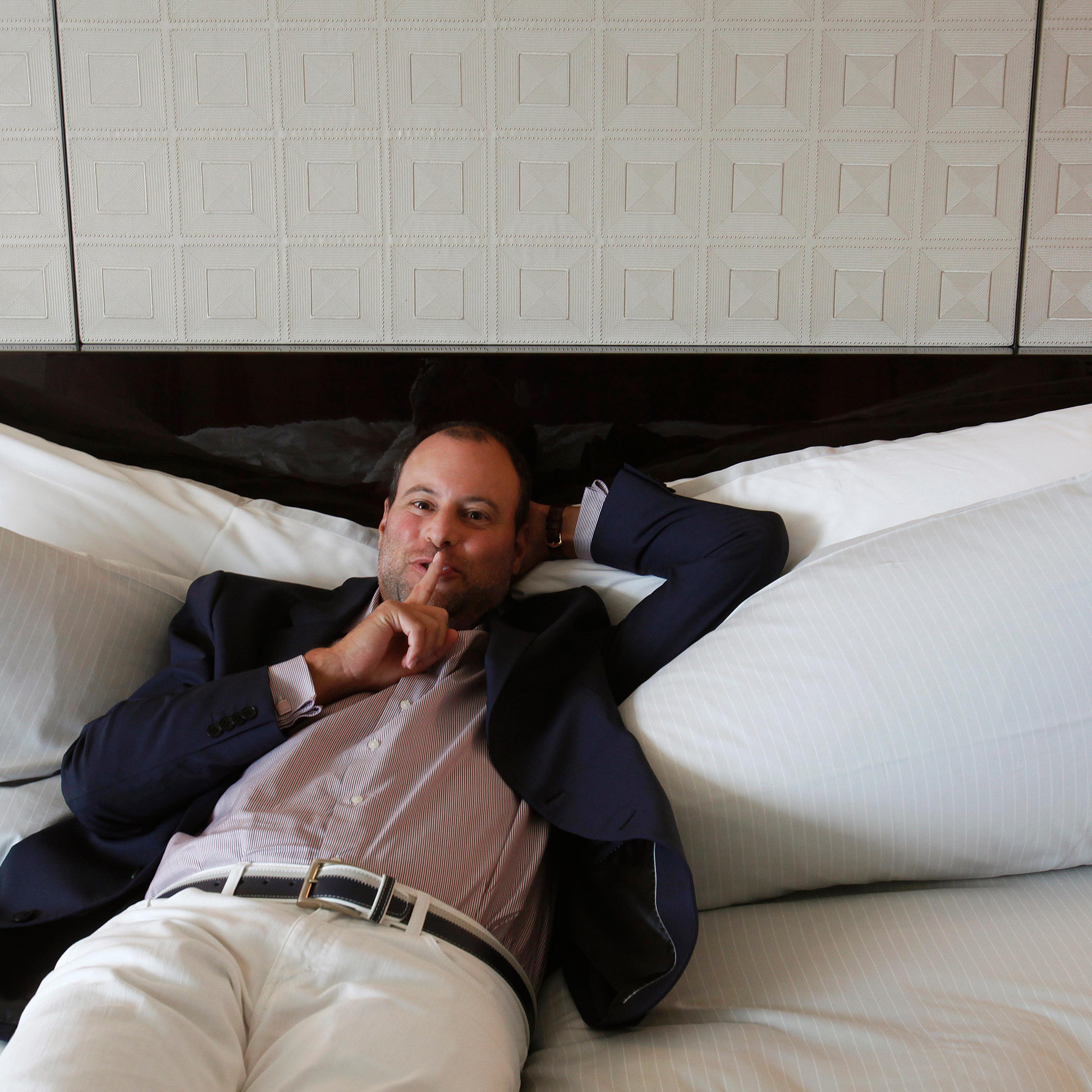 Ashley Madison founder Noel Biderman poses during an interview in Hong Kong